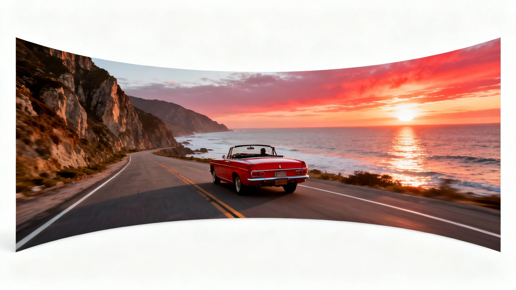 An image demonstrating video outpainting, showing a red convertible on a coastal road. The original frame is seamlessly expanded into an ultra-wide panoramic view of the coastline and ocean at sunset, presented on a white background.