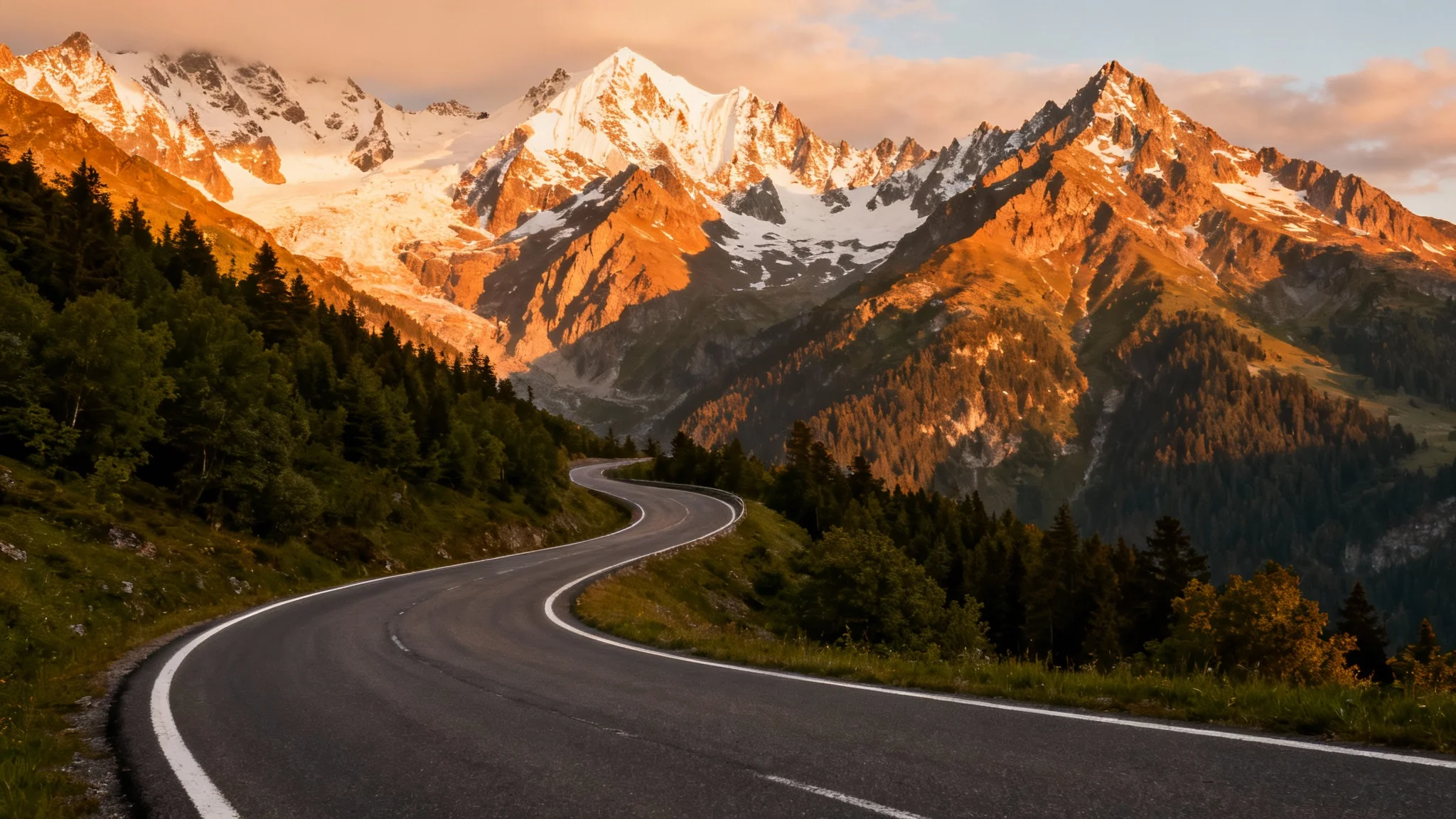 An empty, winding mountain road at sunset, perfect as a scenic background for a car.