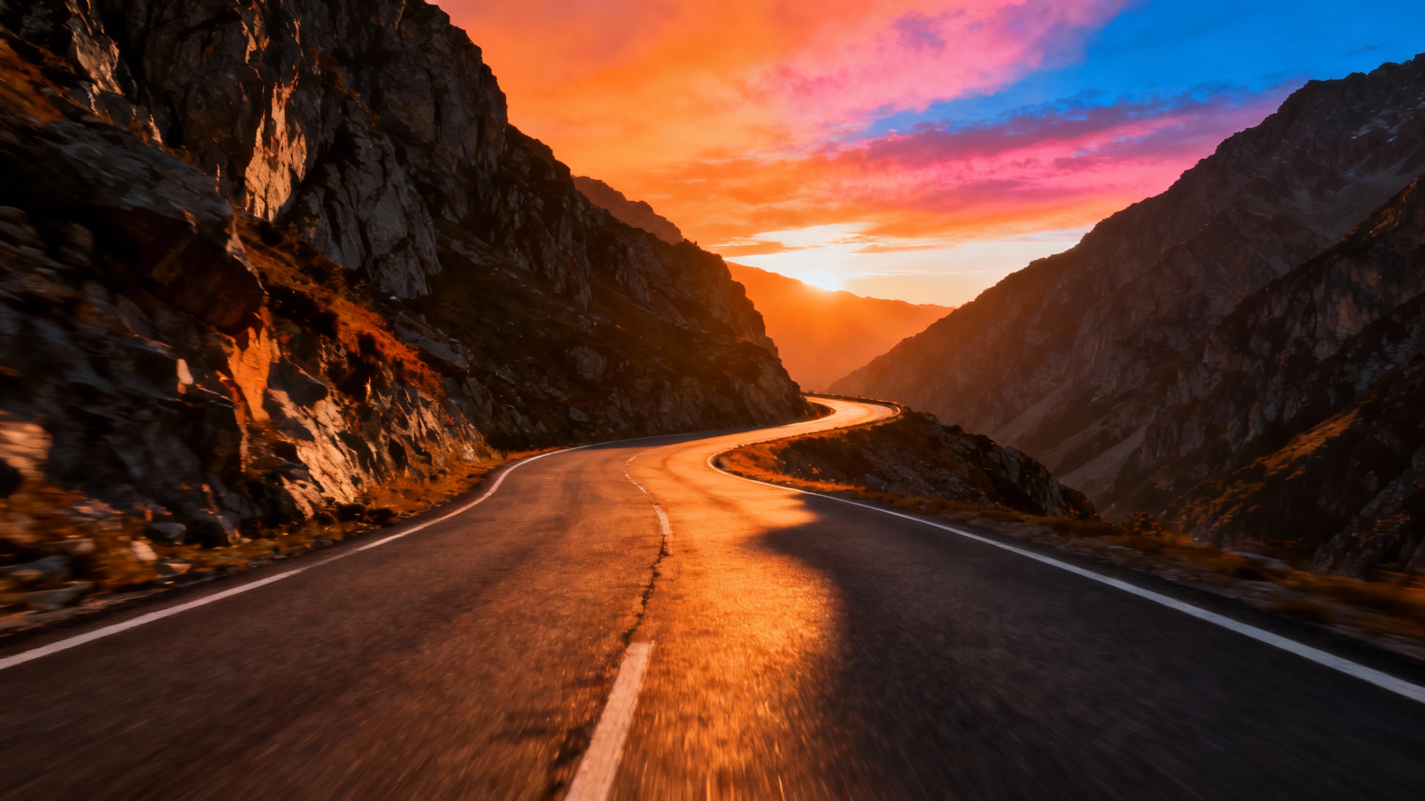 A dramatic, photorealistic image of an empty winding mountain road at sunset, designed as a high-quality background for a car.