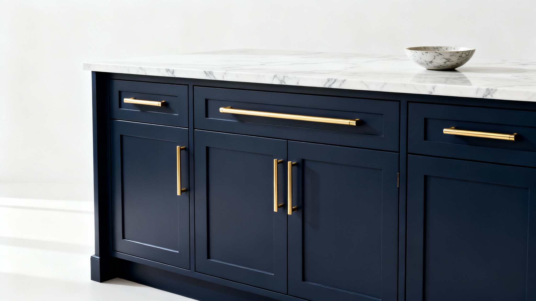 A photorealistic mockup of a modern kitchen island with stylish navy blue cabinets and gold handles, set against a clean white background to showcase cabinet design.