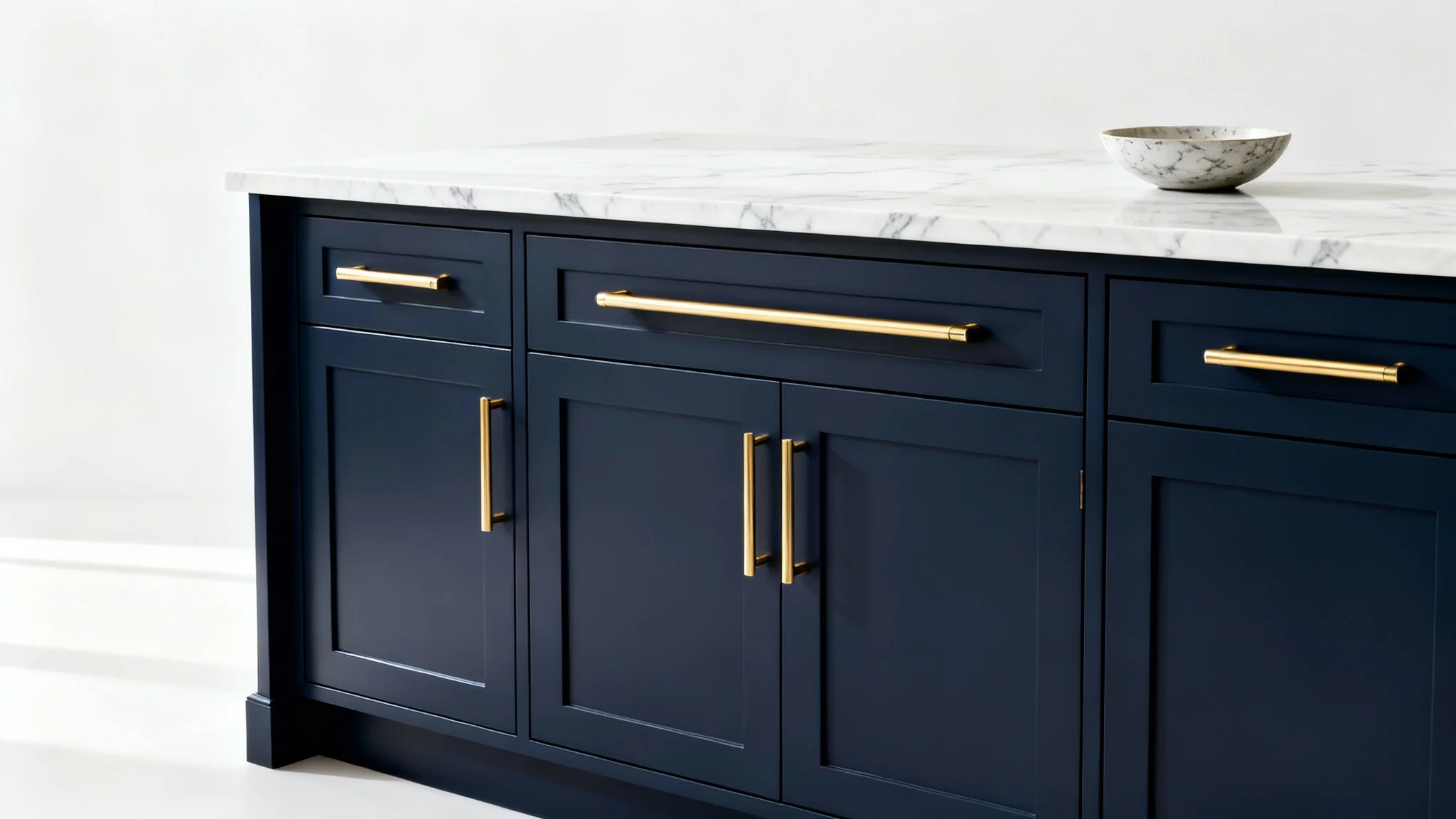 A photorealistic mockup of a modern kitchen island with stylish navy blue cabinets and gold handles, set against a clean white background to showcase cabinet design.