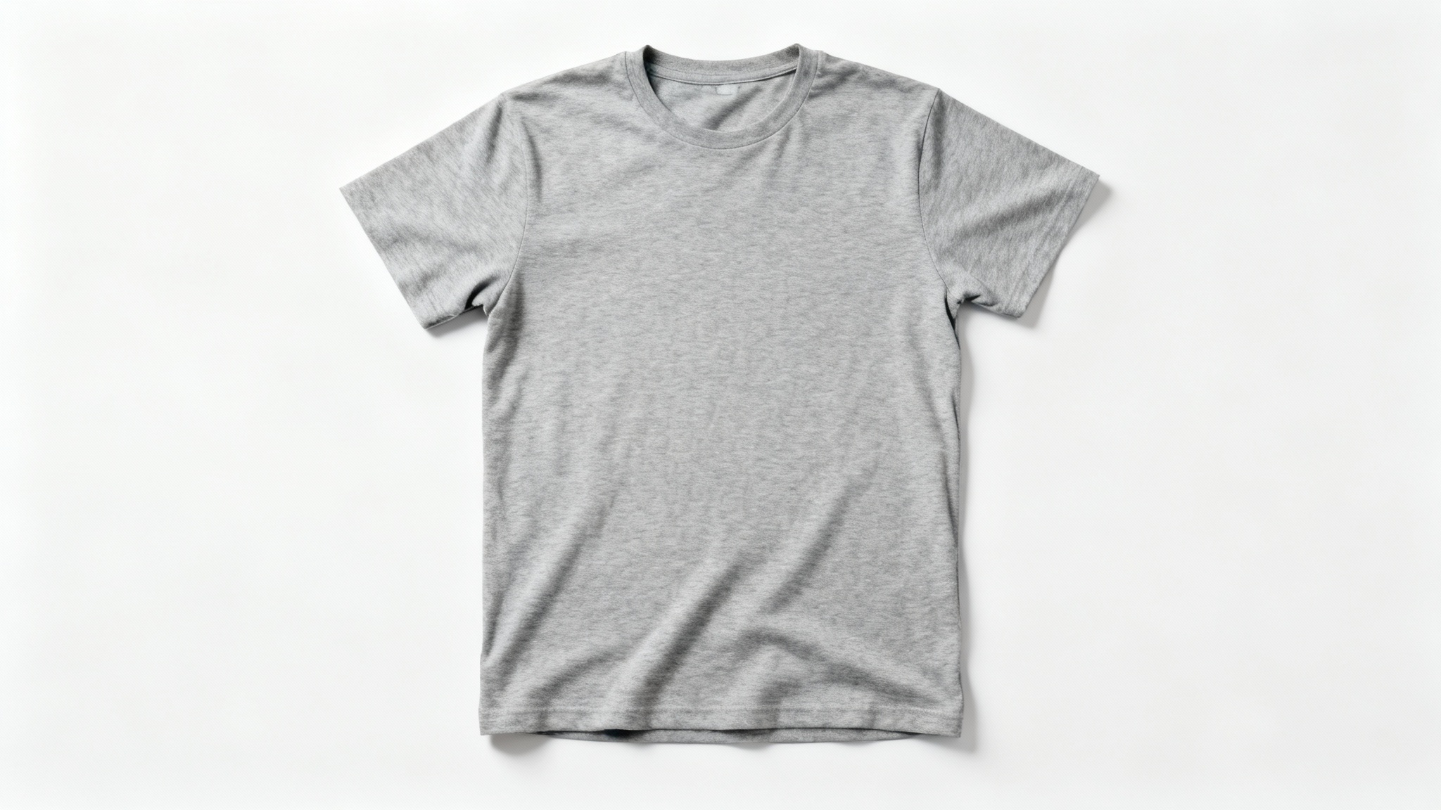 A photorealistic top-down view of a blank heather grey t-shirt laid flat on a white background, serving as a clean mockup for a clothing design.