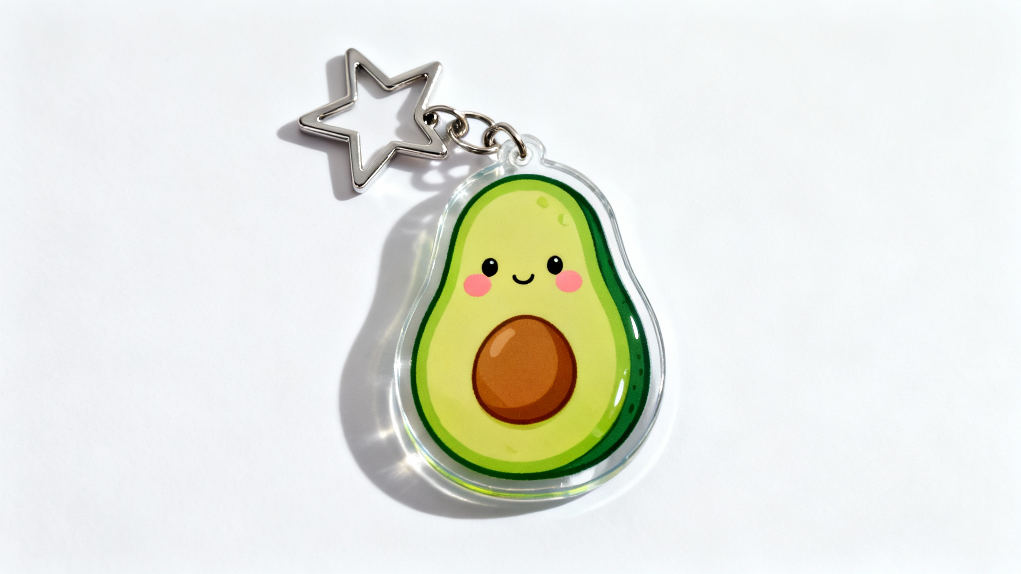 A photorealistic mockup of a custom-shaped acrylic keychain featuring a cute kawaii avocado design, with a star-shaped clasp, presented on a clean white background.