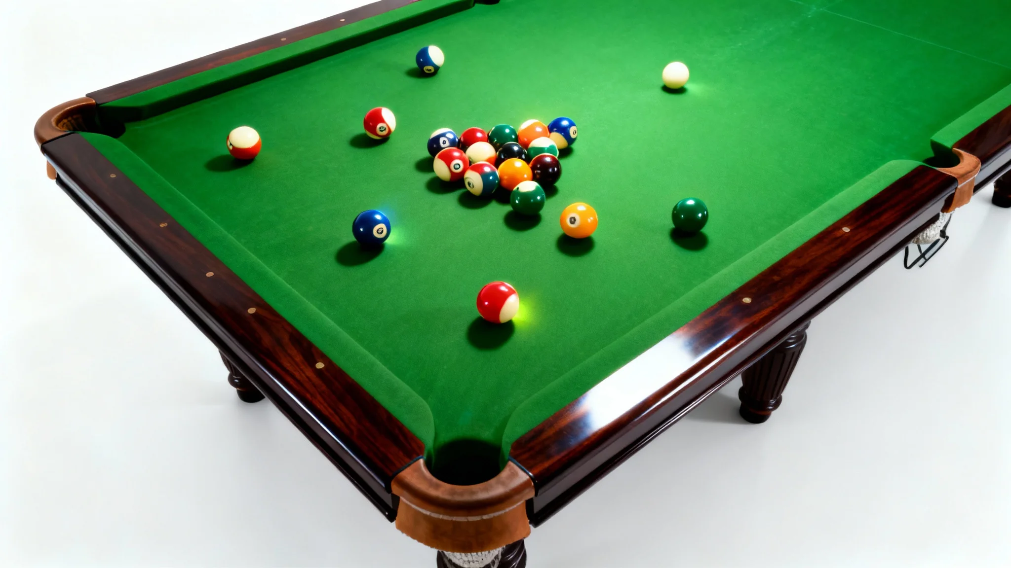 A high-angle, professional photograph of a pool table with brightly colored balls scattered across the green felt, isolated against a clean white background.