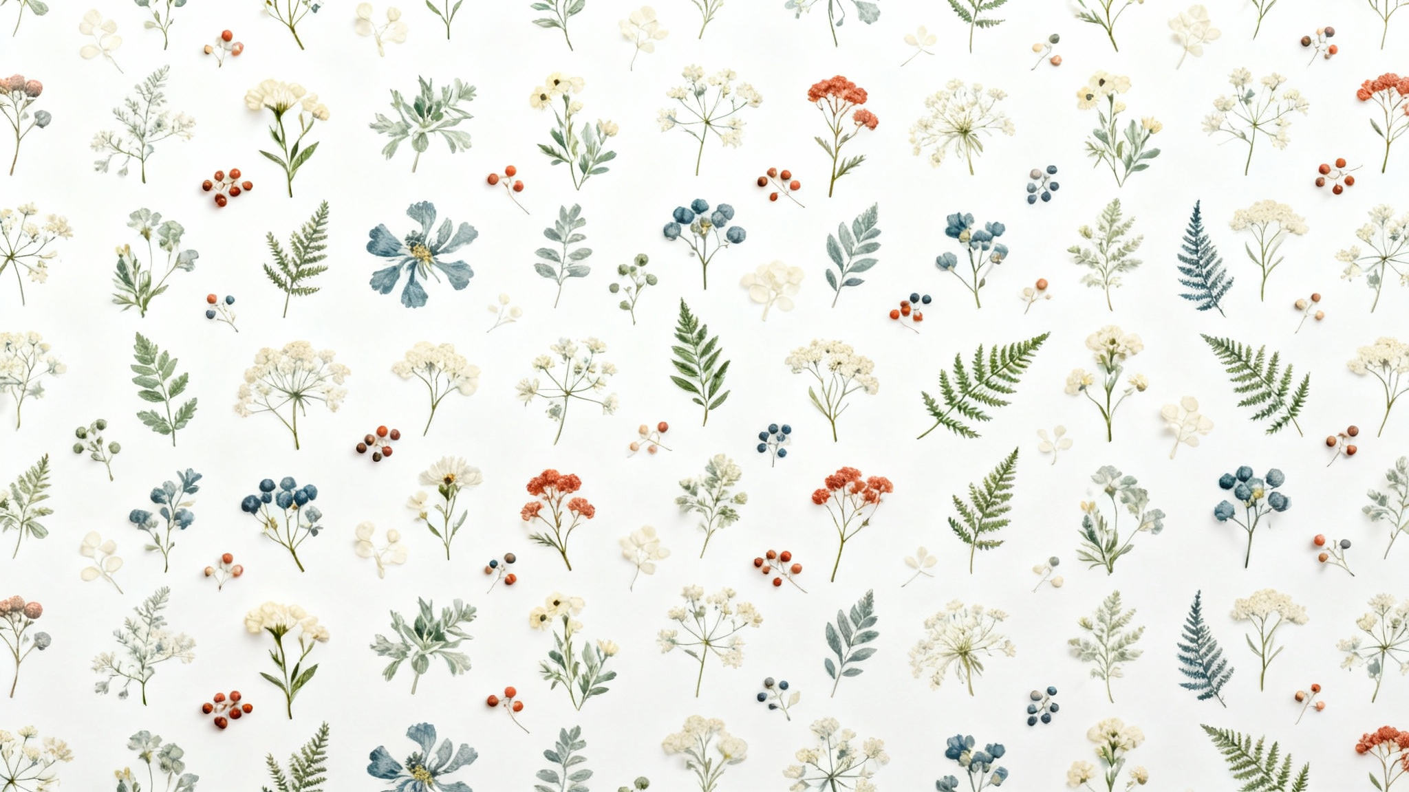 A flat lay of a seamless botanical pattern swatch, featuring vintage-style illustrations of wildflowers and ferns in earthy tones on a crisp white background.