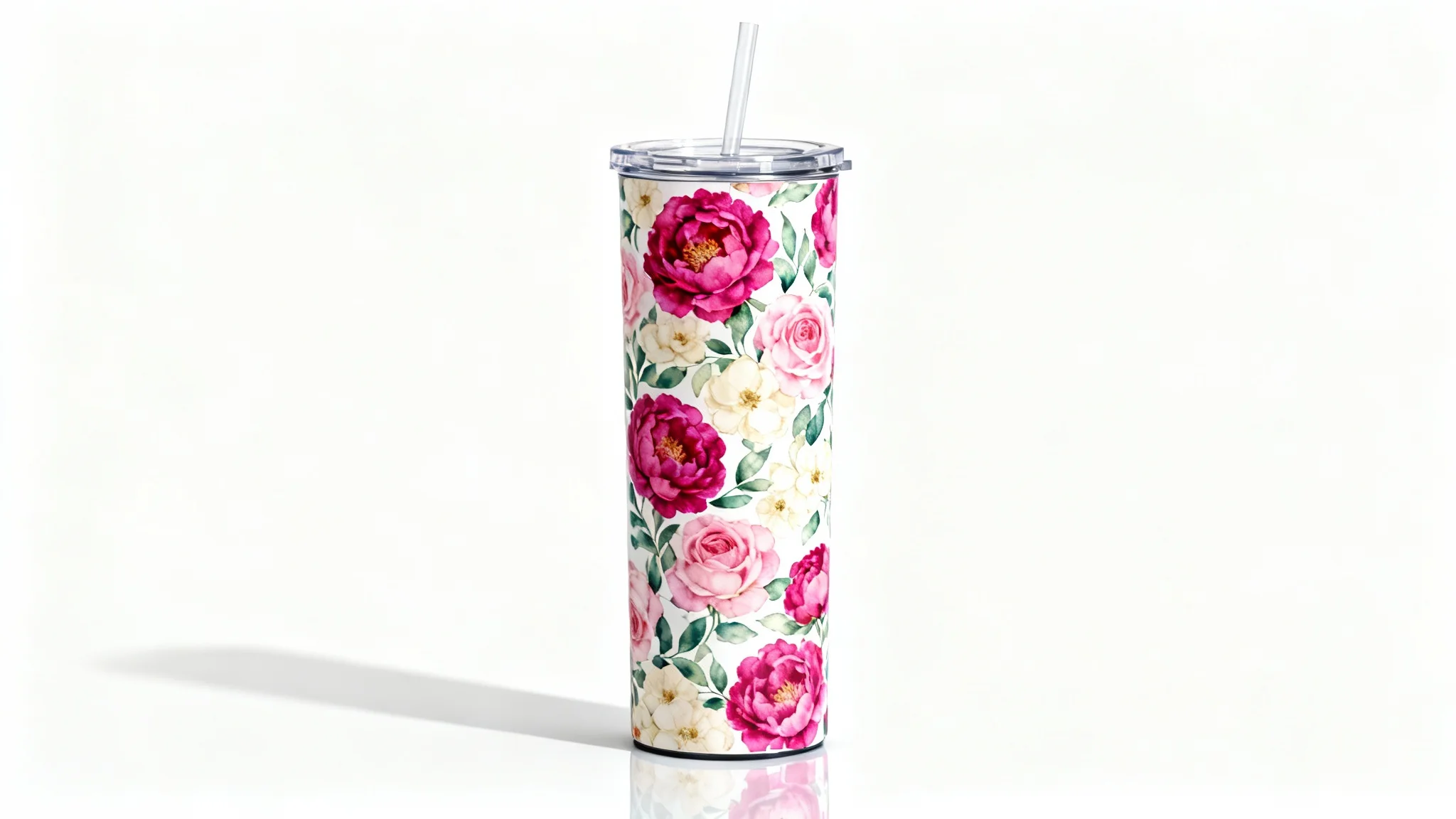A photorealistic product mockup of a 20 oz skinny tumbler with a vibrant watercolor floral wrap design, complete with a clear lid and straw, set against a clean white background.