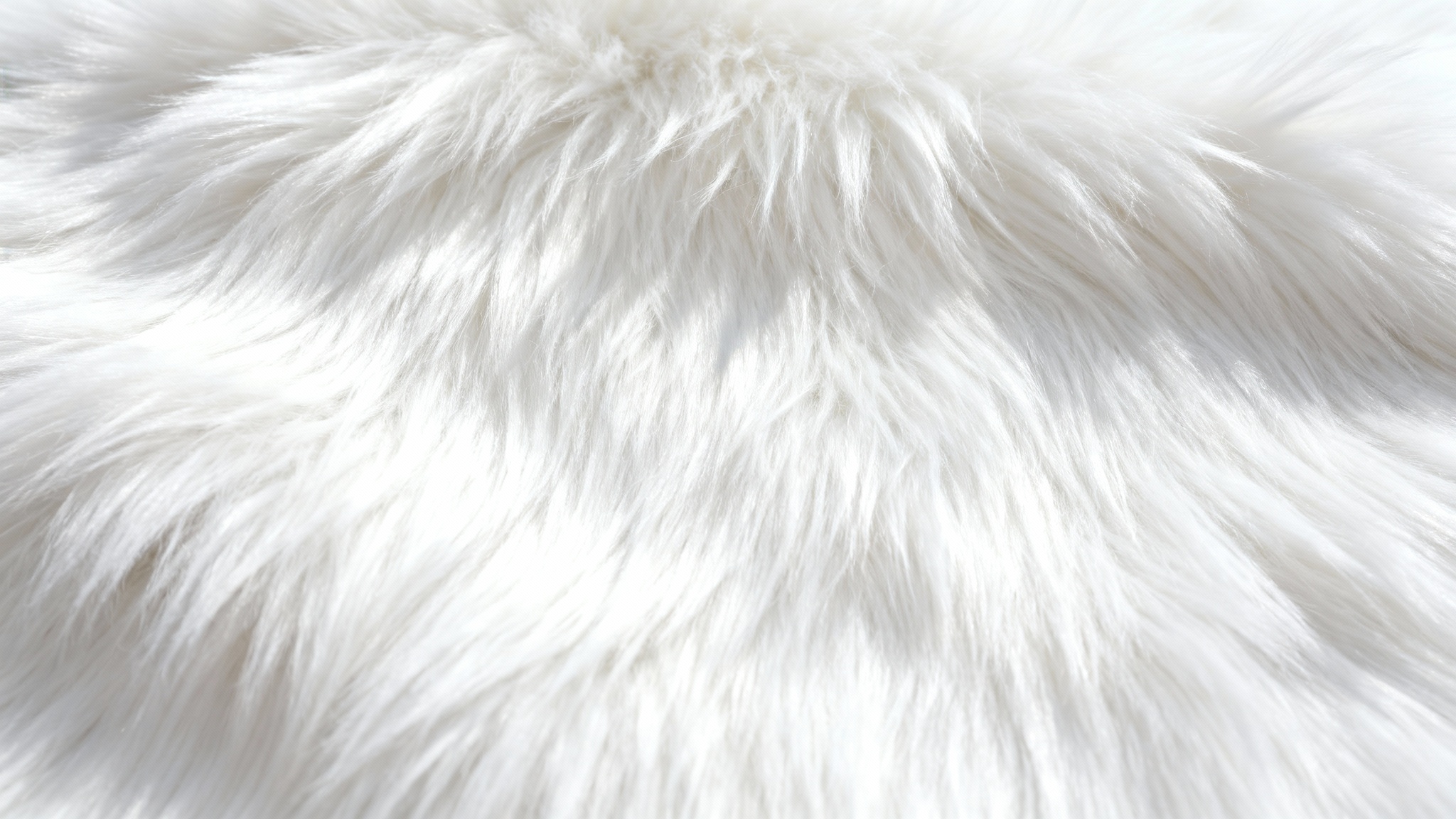 A hyper-realistic, macro photograph showing the detailed texture of a soft, white faux fur against a clean white background.
