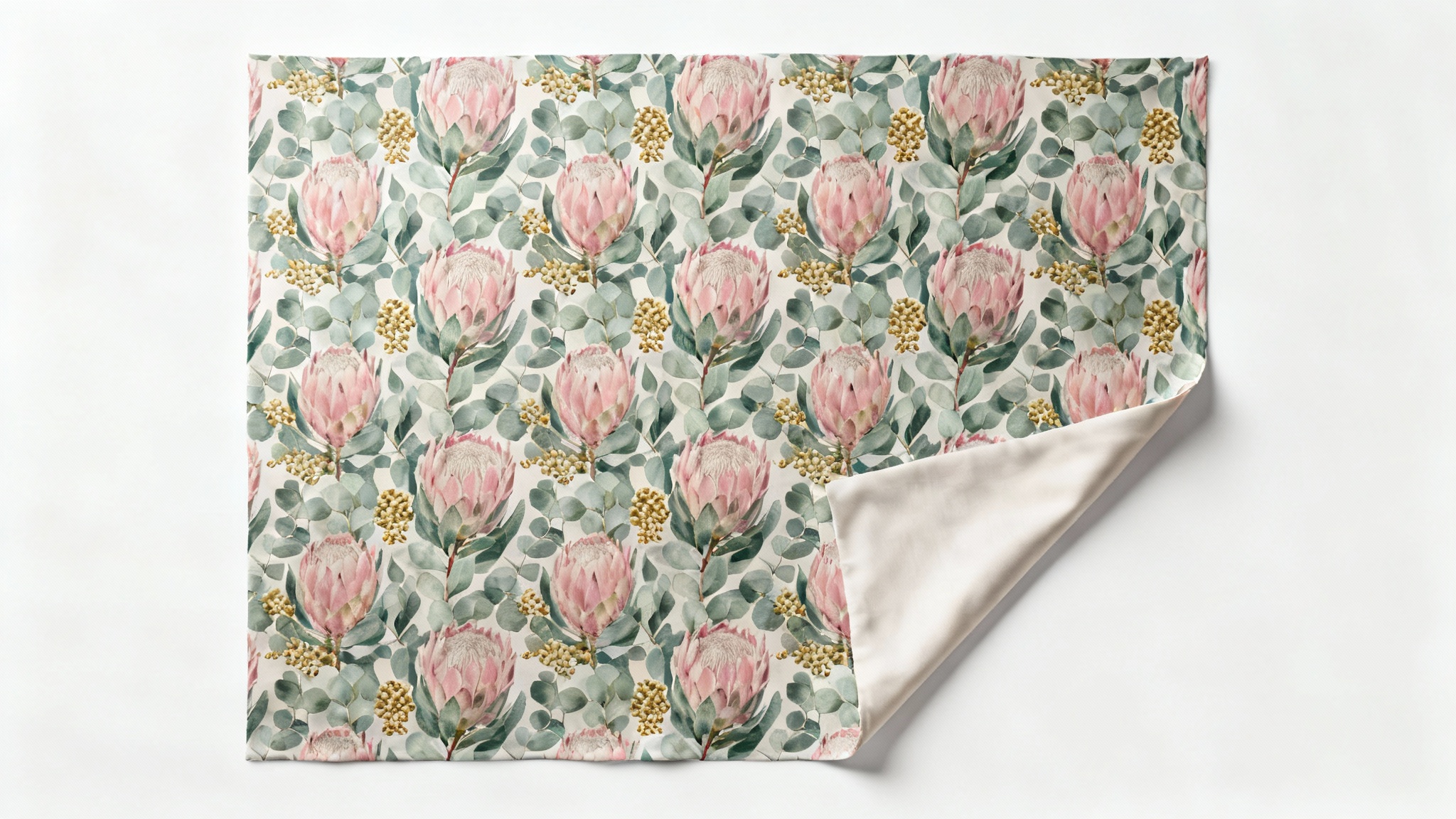 A top-down view of a sophisticated surface pattern design featuring pink protea flowers and sage-green leaves printed on a piece of fabric, set against a plain white background.