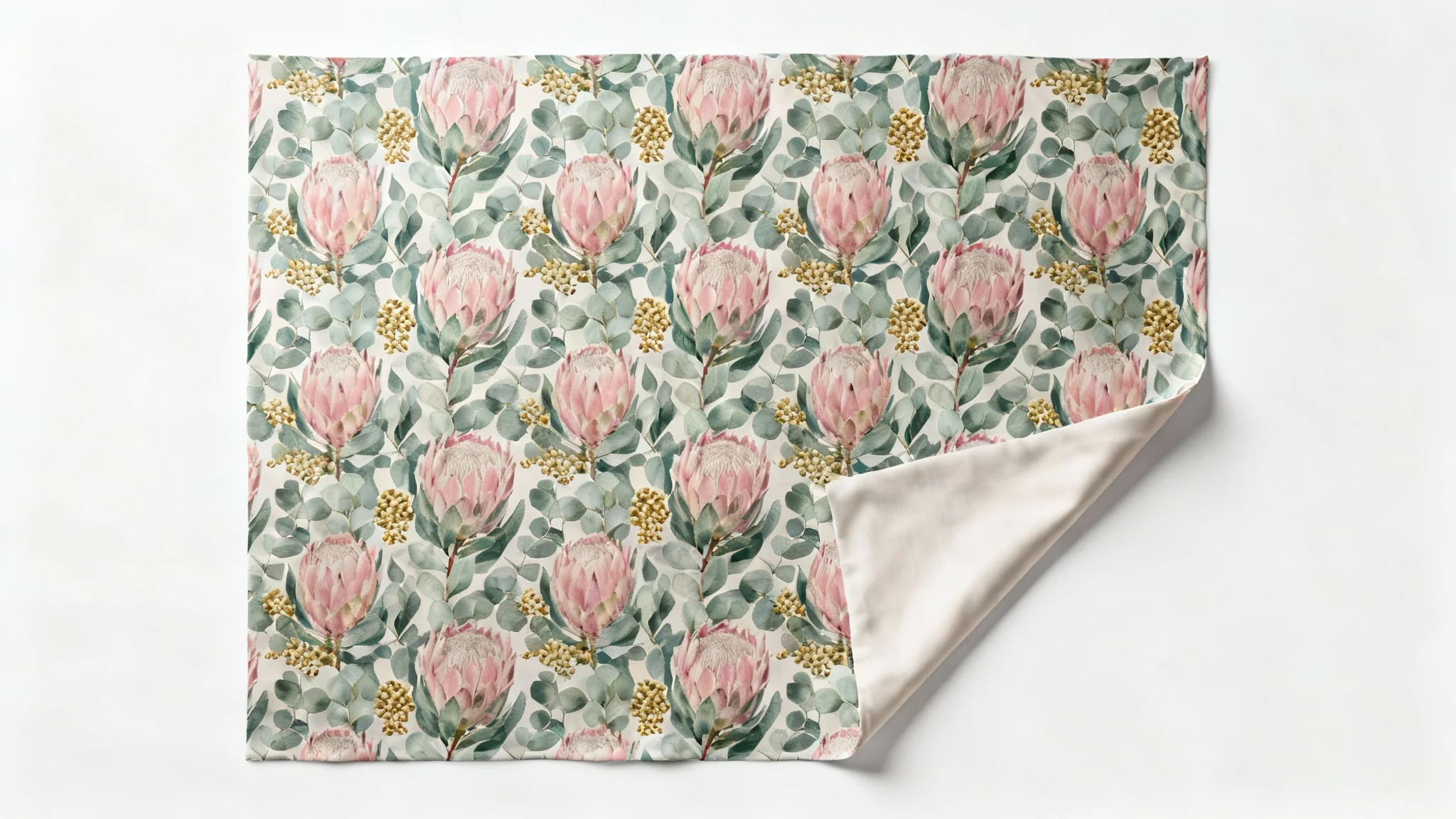 A top-down view of a sophisticated surface pattern design featuring pink protea flowers and sage-green leaves printed on a piece of fabric, set against a plain white background.