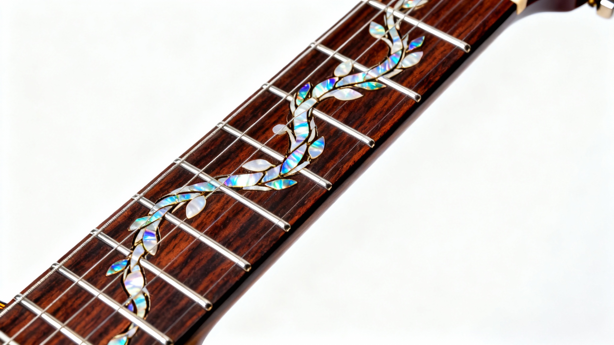 A detailed close-up of a custom guitar fretboard inlay showing an intricate vine design made of shimmering mother-of-pearl on dark rosewood, set against a clean white background.