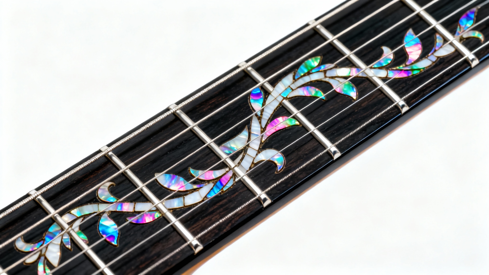 A close-up, detailed photograph of a dark ebony guitar fretboard featuring an intricate, shimmering vine inlay made of colorful mother-of-pearl, presented against a clean white background.