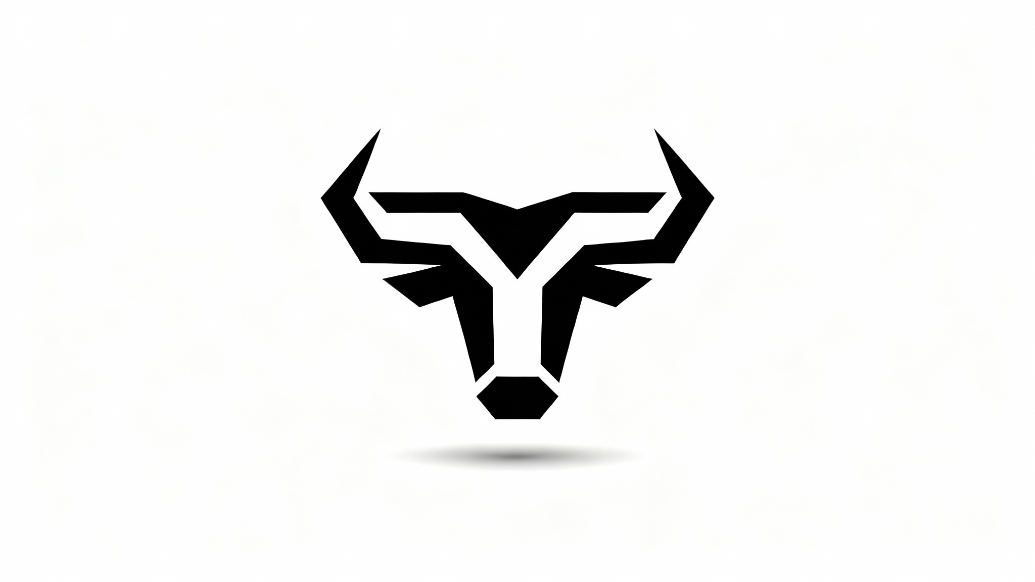 A modern, minimalist black logo of a geometric bull's head, presented as a professional mockup on a clean white background.