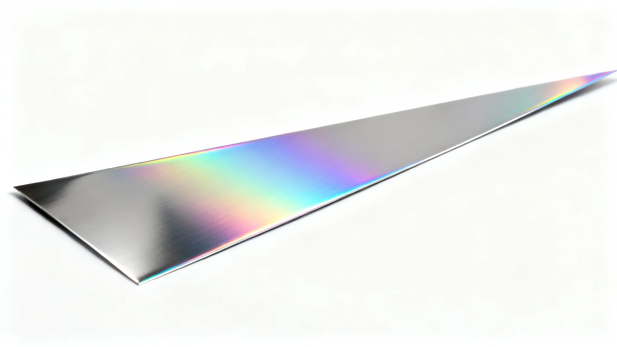 An extreme close-up of a polished chrome surface with an iridescent, rainbow-colored sheen, isolated on a solid white background.