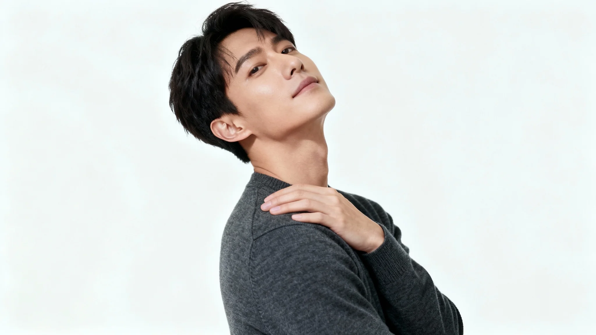 A photorealistic image of a person demonstrating a classic portrait pose against a solid white background, intended as a reference for photographers or artists.