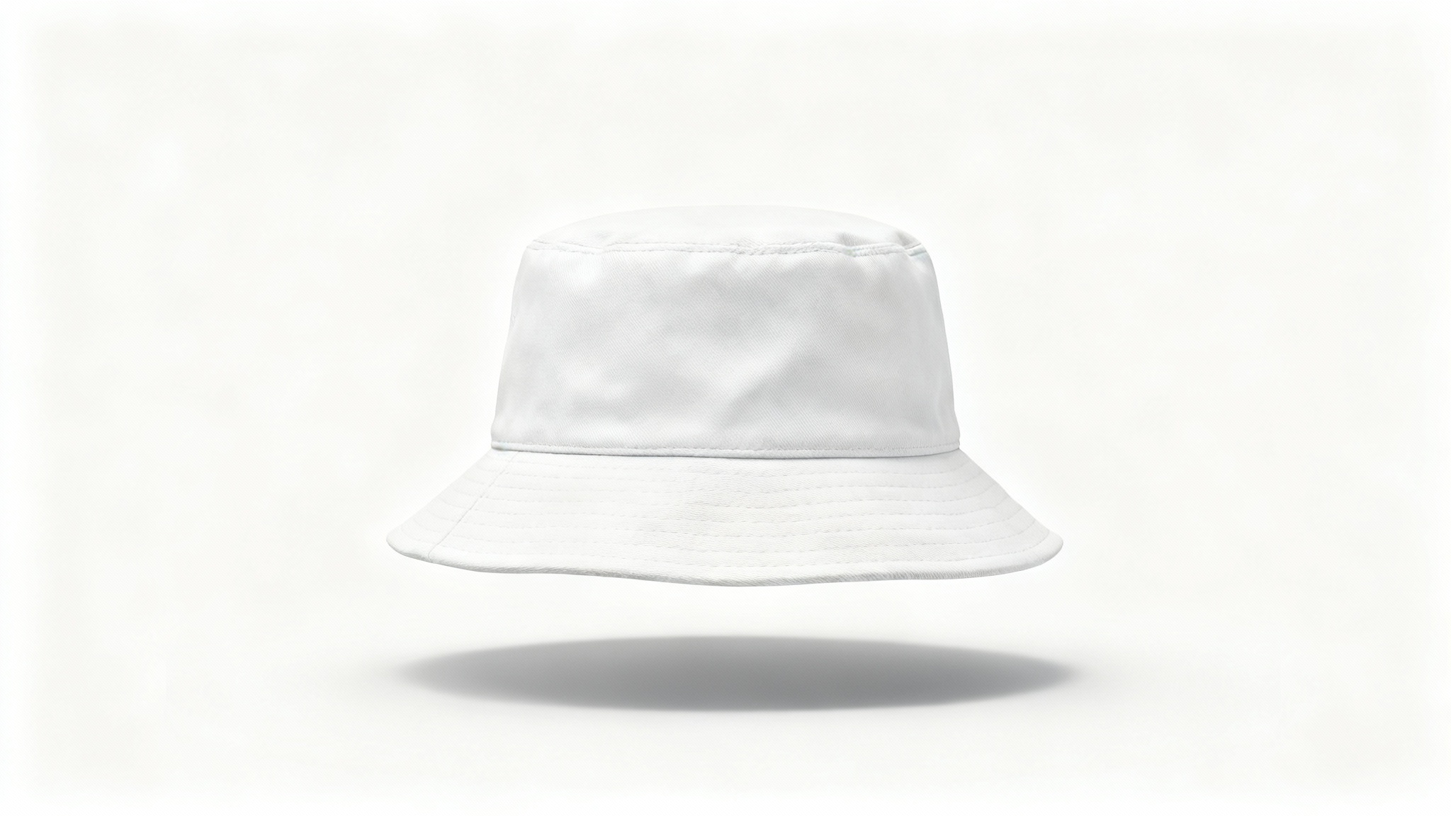 A photorealistic mockup of a white cotton bucket hat viewed from the front, set against a plain white background in a studio setting.