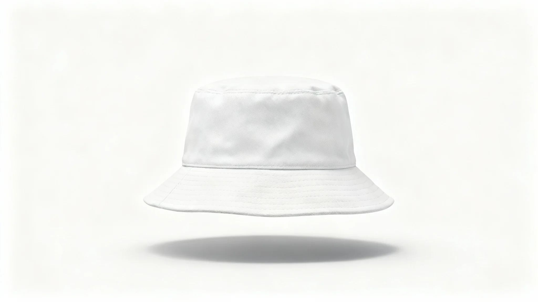 A photorealistic mockup of a white cotton bucket hat viewed from the front, set against a plain white background in a studio setting.