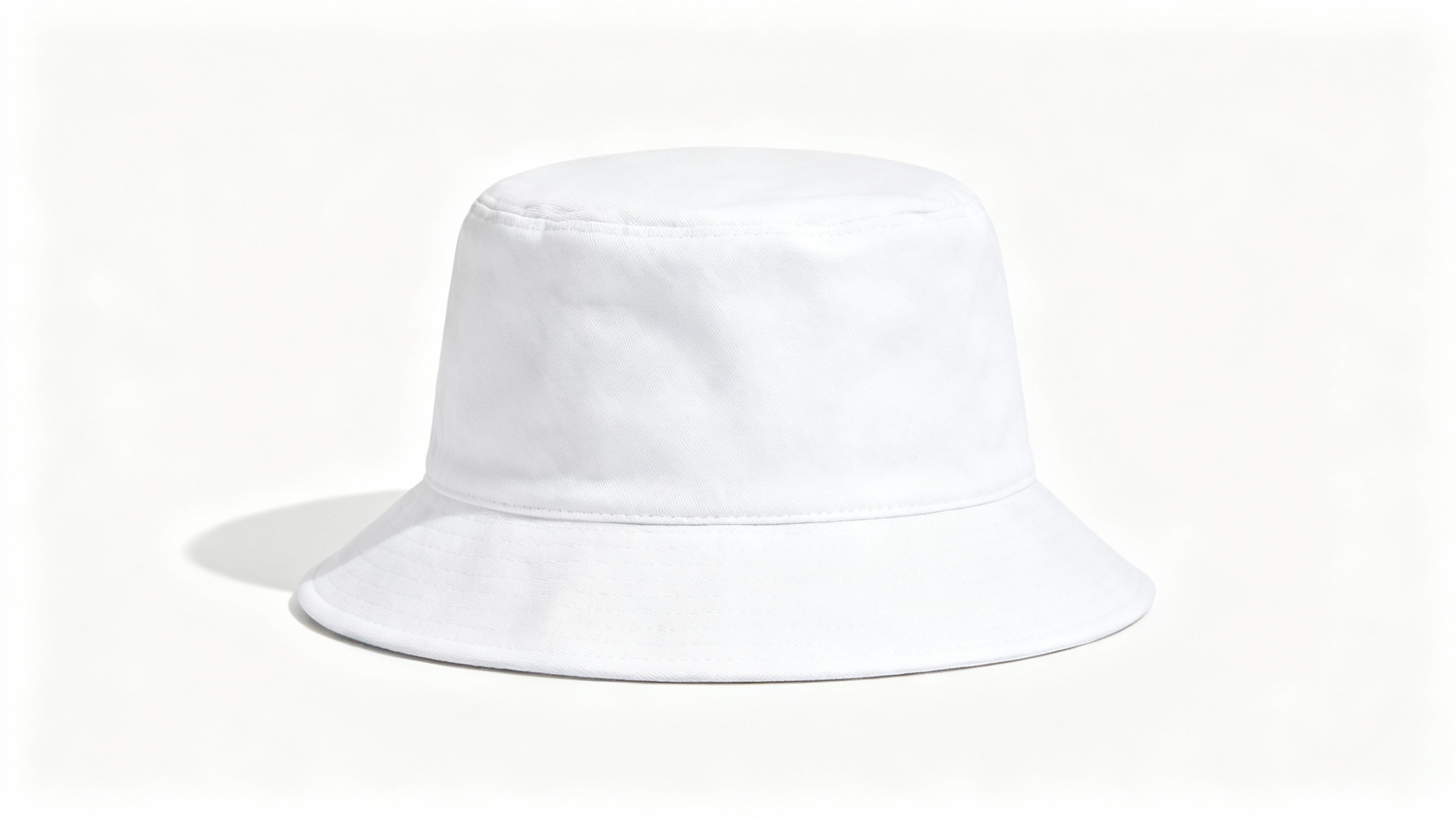 A studio product shot of a plain white bucket hat viewed from the front, set against a clean white background, serving as a mockup.