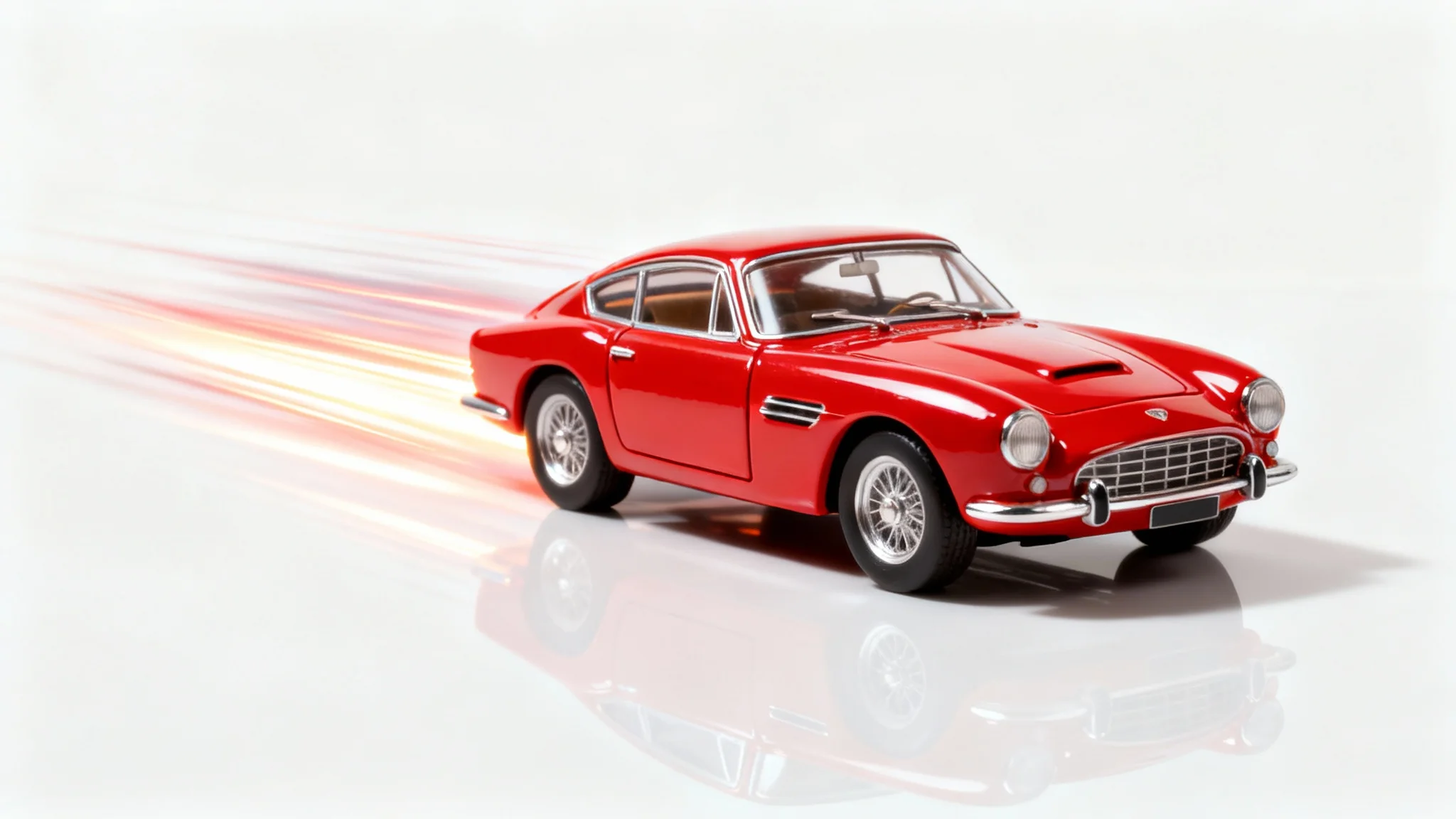 A professionally edited studio photograph of a red vintage toy car on a white background, with dynamic light and motion effects added to make it look like it's speeding.