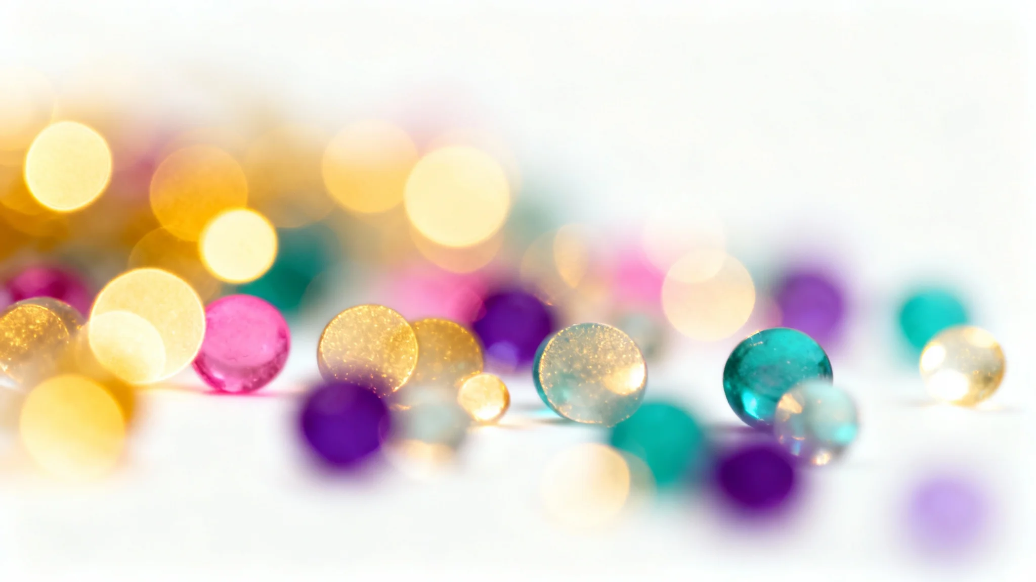 A vibrant and dreamy background image featuring colorful, out-of-focus bokeh lights in shades of gold, blue, and purple, creating a magical atmosphere.