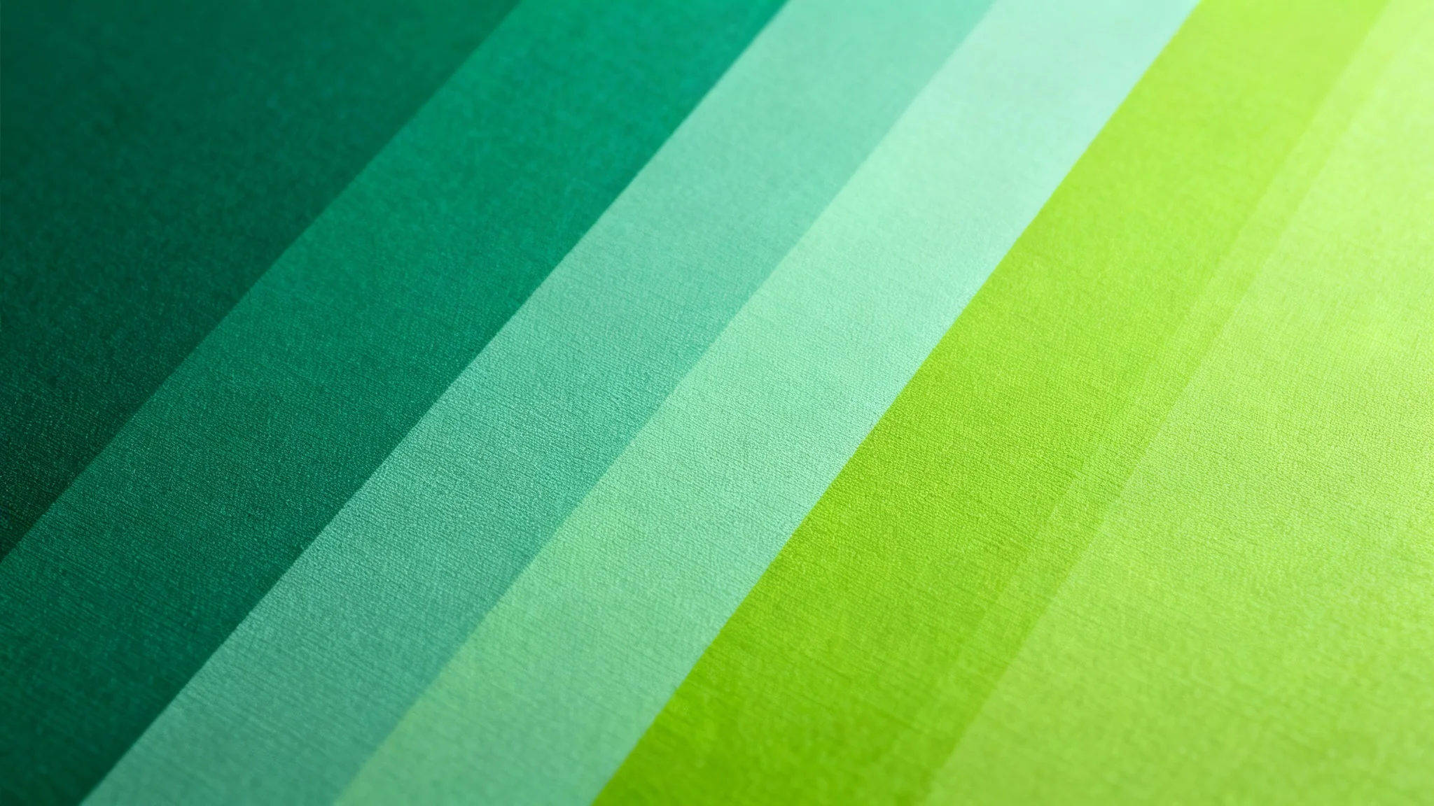 A high-quality digital background texture showing a smooth gradient from deep emerald to bright lime green, with a subtle grain finish.