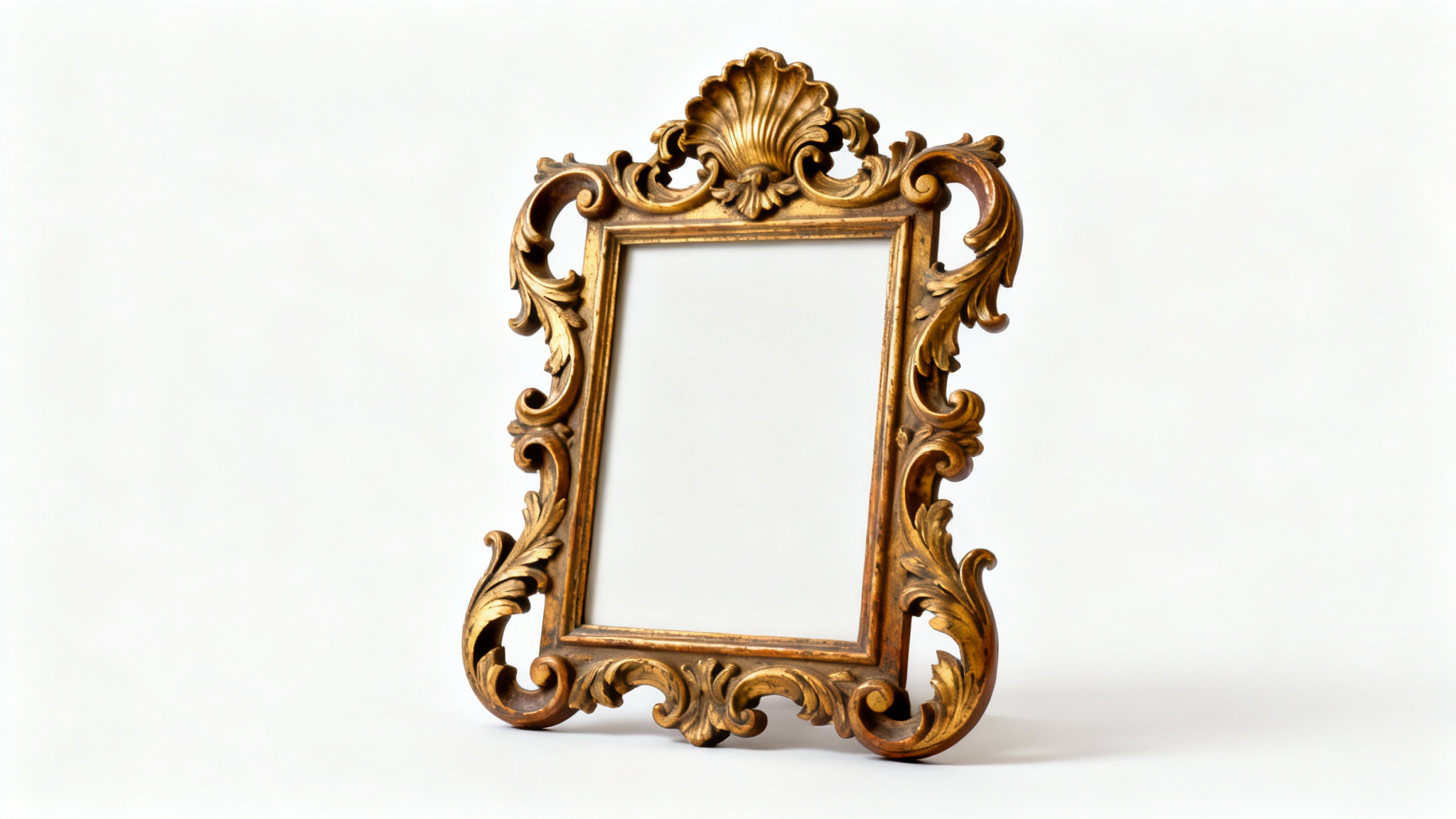 A close-up of a luxurious, gold-gilded Rococo picture frame with intricate carvings of scrolls and leaves, displayed on a pure white background.