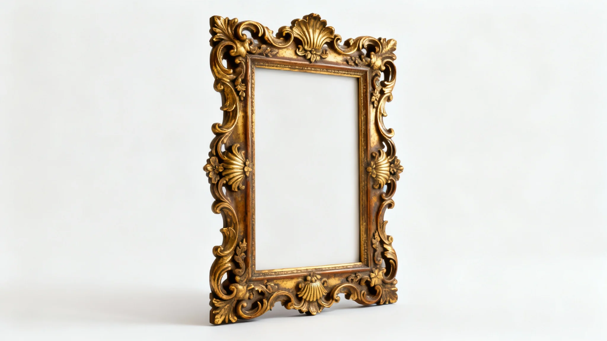 A close-up product photo of a luxurious, gold-gilded Rococo picture frame with intricate, swirling carvings, standing vertically on a plain white background.