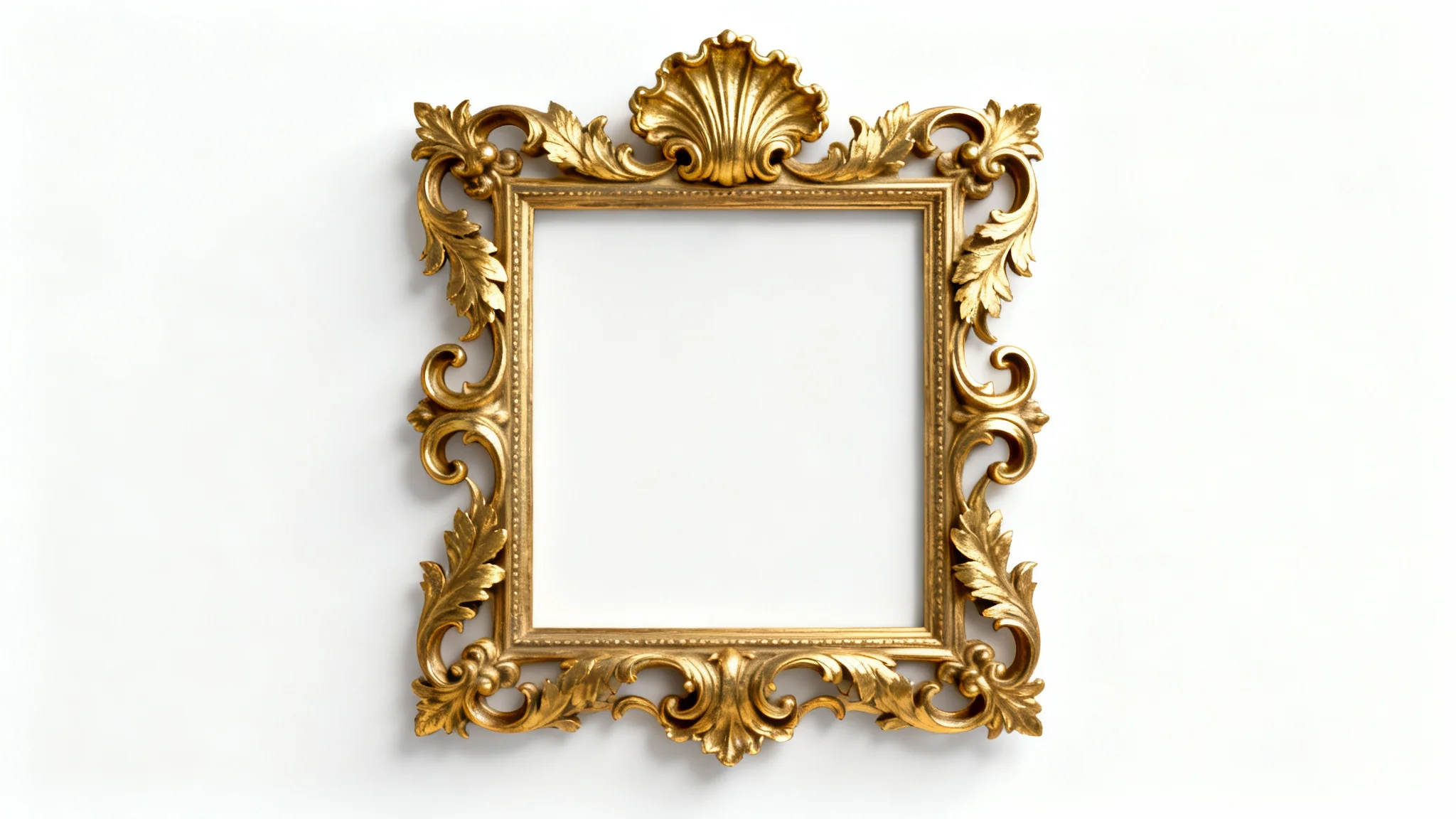 An ornate, gold Rococo-style picture frame with intricate carvings of leaves and scrolls, shown empty against a plain white background.