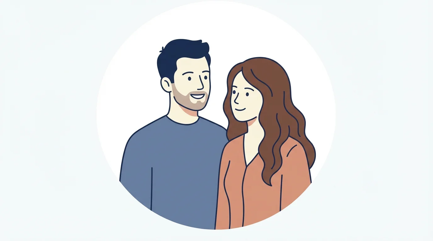 A minimalist cartoon avatar of a smiling couple, a man with a beard and a woman with long brown hair, shown from the chest up against a solid white background.