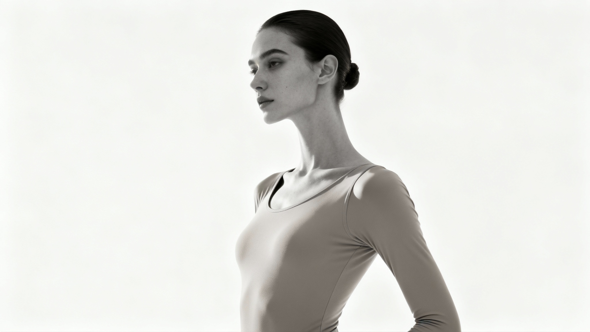 A minimalist studio photograph of a person with perfect, elegant posture standing against a clean white background, looking confident and healthy.