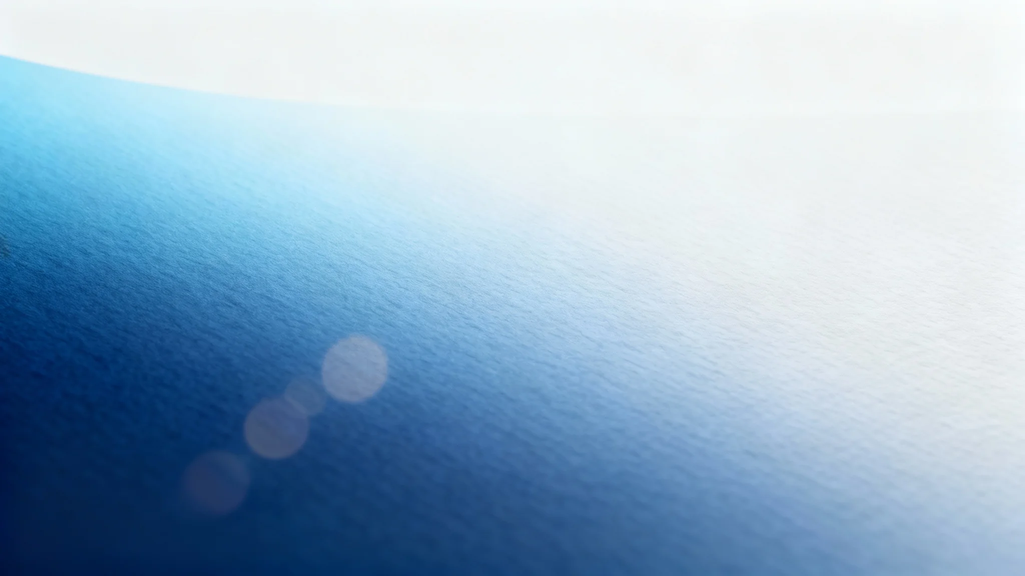 A sophisticated blue background mockup showing a smooth gradient from dark navy to light sky blue, presented cleanly on a white surface.