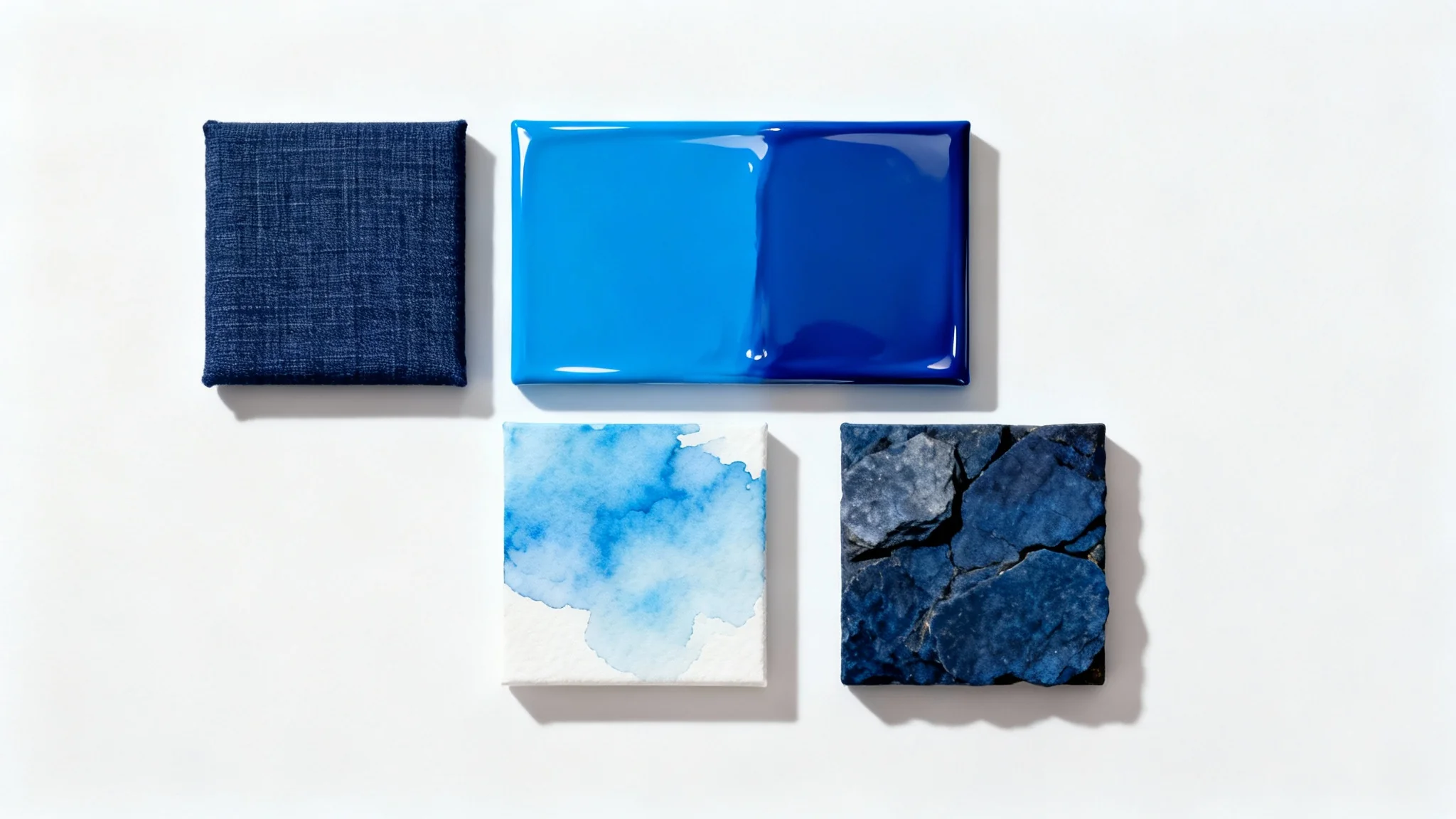 A mockup showcasing four square samples of different blue backgrounds arranged on a white surface. The backgrounds include navy linen, glossy cerulean, sky blue watercolor, and indigo stone textures.