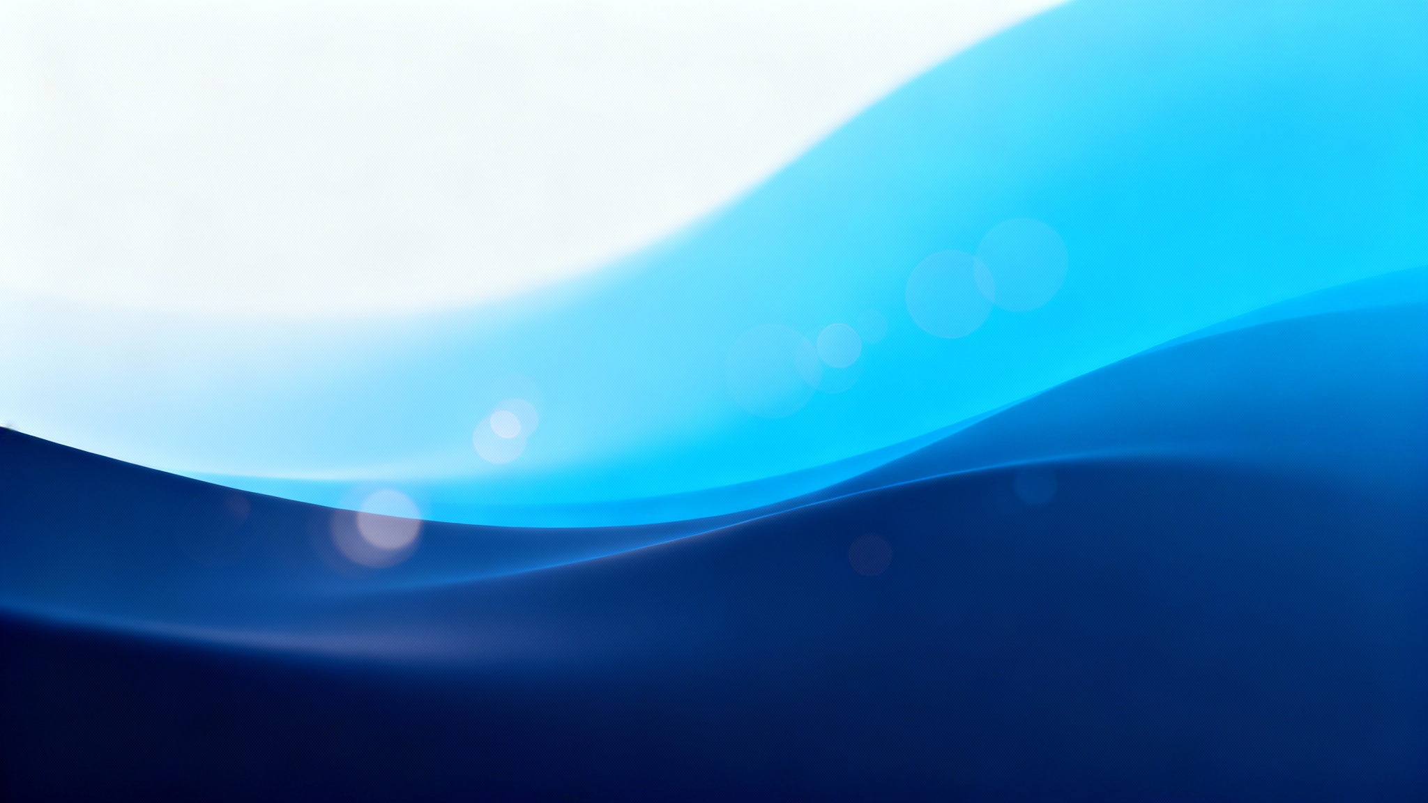 A high-quality, abstract blue background with a smooth gradient from dark navy to bright cerulean, featuring soft light flares for an elegant and modern look.
