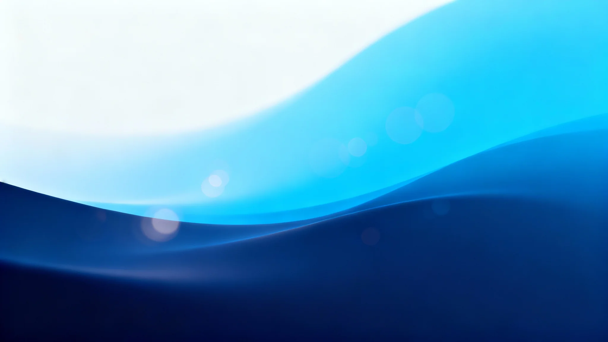 A high-quality, abstract blue background with a smooth gradient from dark navy to bright cerulean, featuring soft light flares for an elegant and modern look.