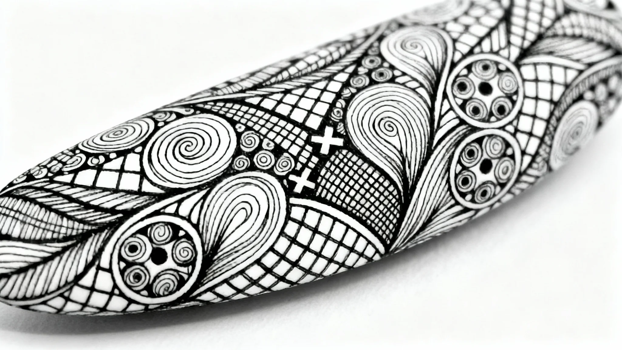 An intricate black and white Zentangle design on a white background, showcasing a variety of complex, structured patterns and fine linework.