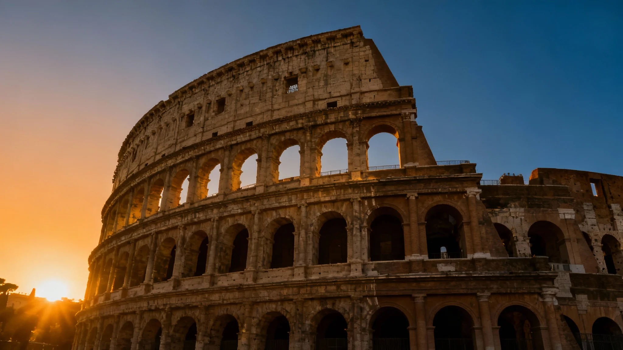 A majestic view of the Roman Colosseum at sunset, its ancient stone architecture glowing in the golden light, creating a perfect background.