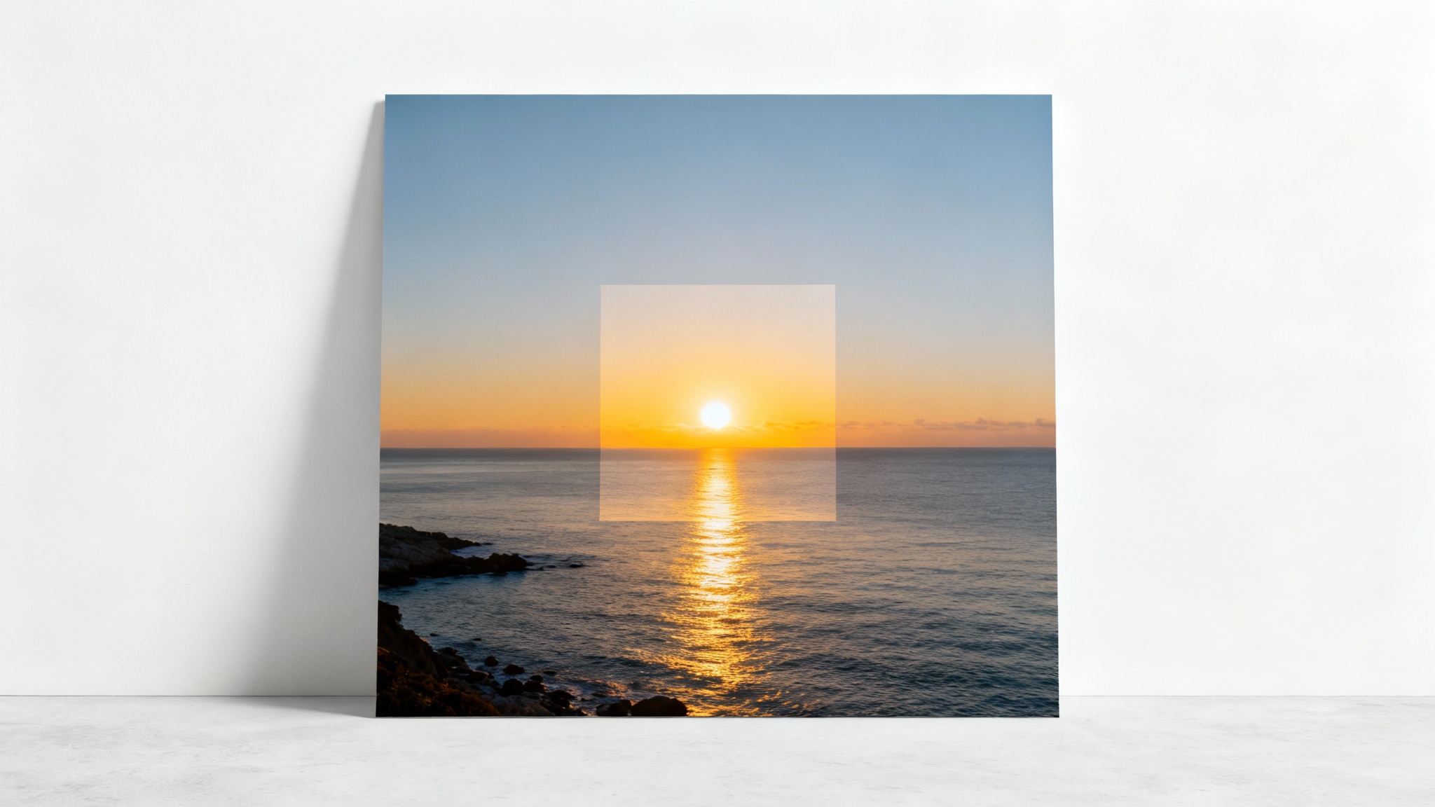 A conceptual image illustrating a square crop. A rectangular photo of a coastal sunrise has a vibrant, focused square section in the middle, while the outer parts of the rectangle are faded, demonstrating the cropping process.
