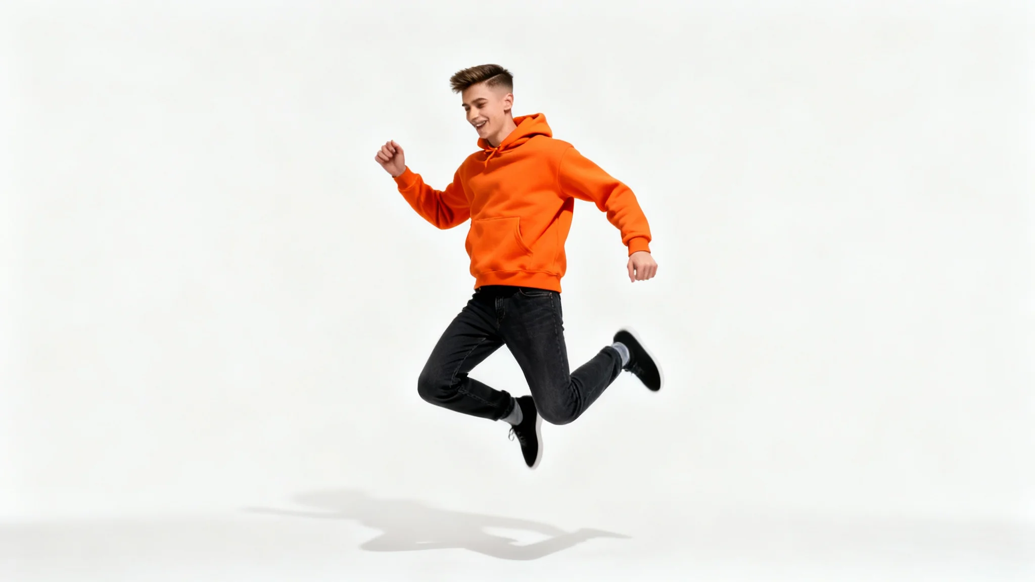 A high-resolution, photorealistic image of a man in an orange hoodie jumping, perfectly cut out from his background and placed on a clean white surface to demonstrate a person cutout feature.