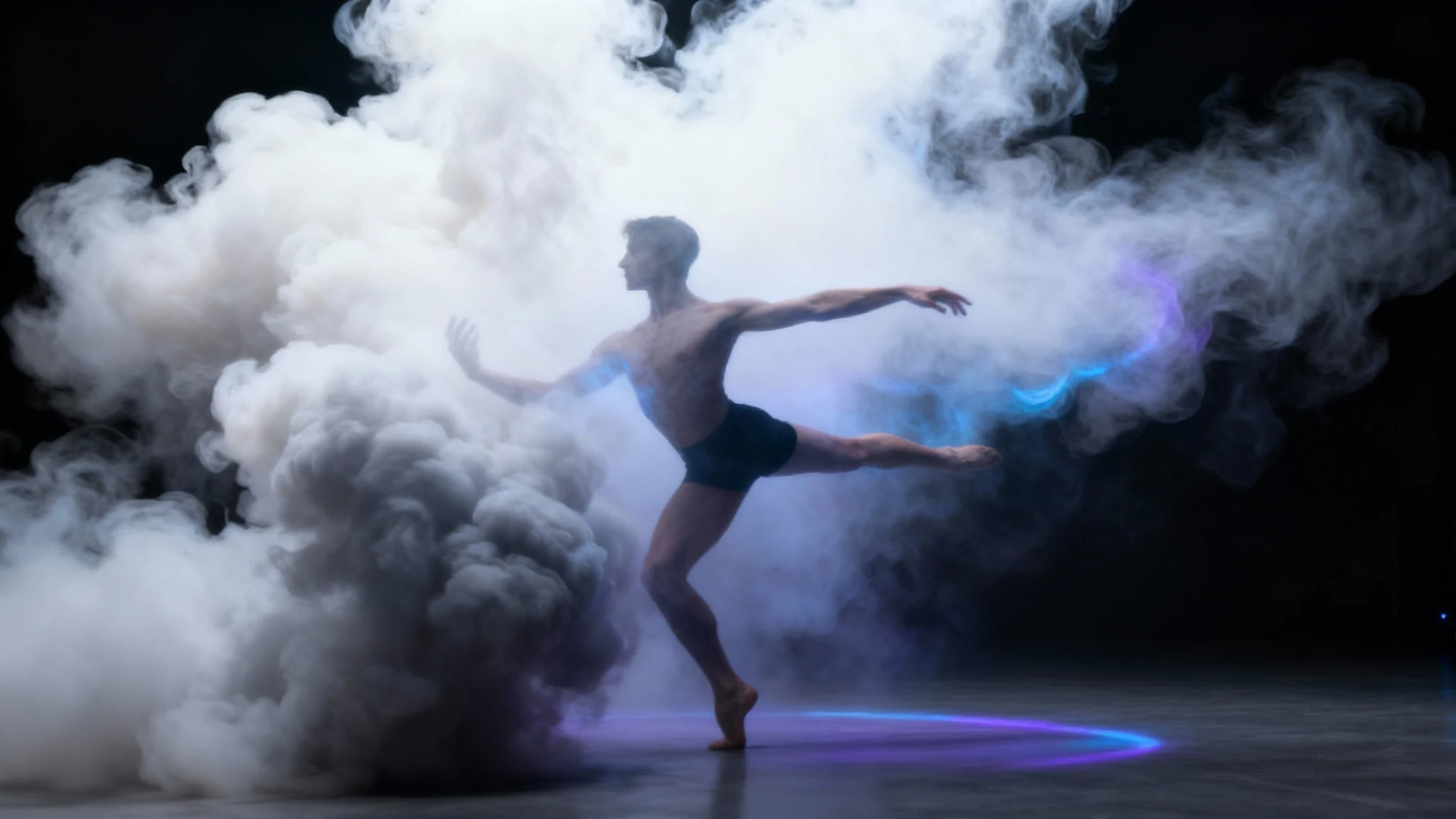 A dramatic 16:9 image showing a dancer's silhouette in mid-air, surrounded by thick, billowing clouds of white smoke, demonstrating a smoke overlay effect. Ethereal blue and purple light highlights the scene.