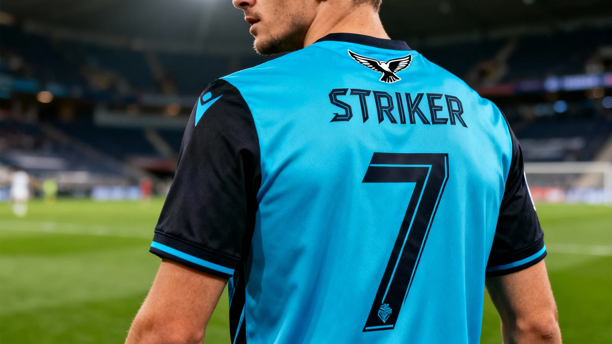 A football player on a field wearing a custom-designed blue and black jersey with the name 'STRIKER' and number '7' on the back, showcasing the result of a football jersey editor.