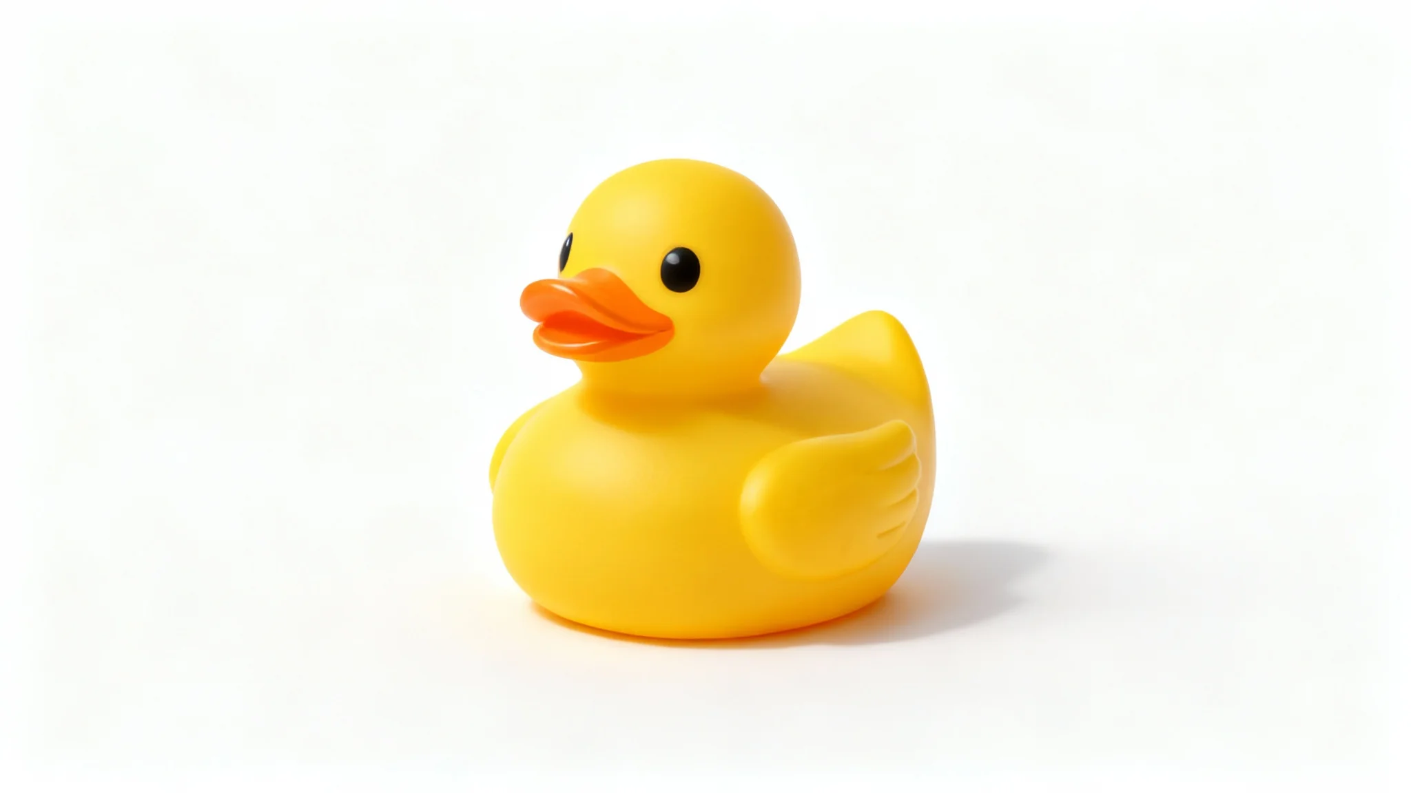 A yellow rubber duck with a transparent background, represented by a grey and white checkerboard pattern, demonstrating a background removal effect.