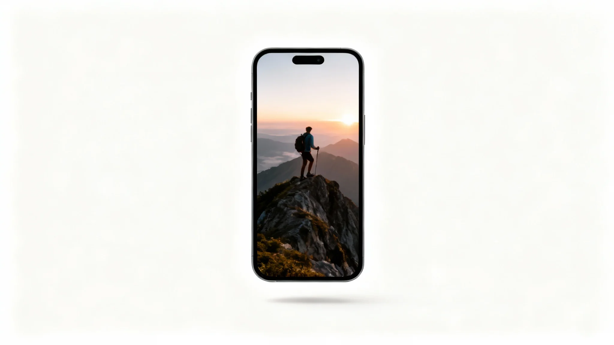A sleek smartphone shown against a white background, displaying a vertically cropped travel video of a person on a mountaintop, demonstrating the final output of a video cropping tool.