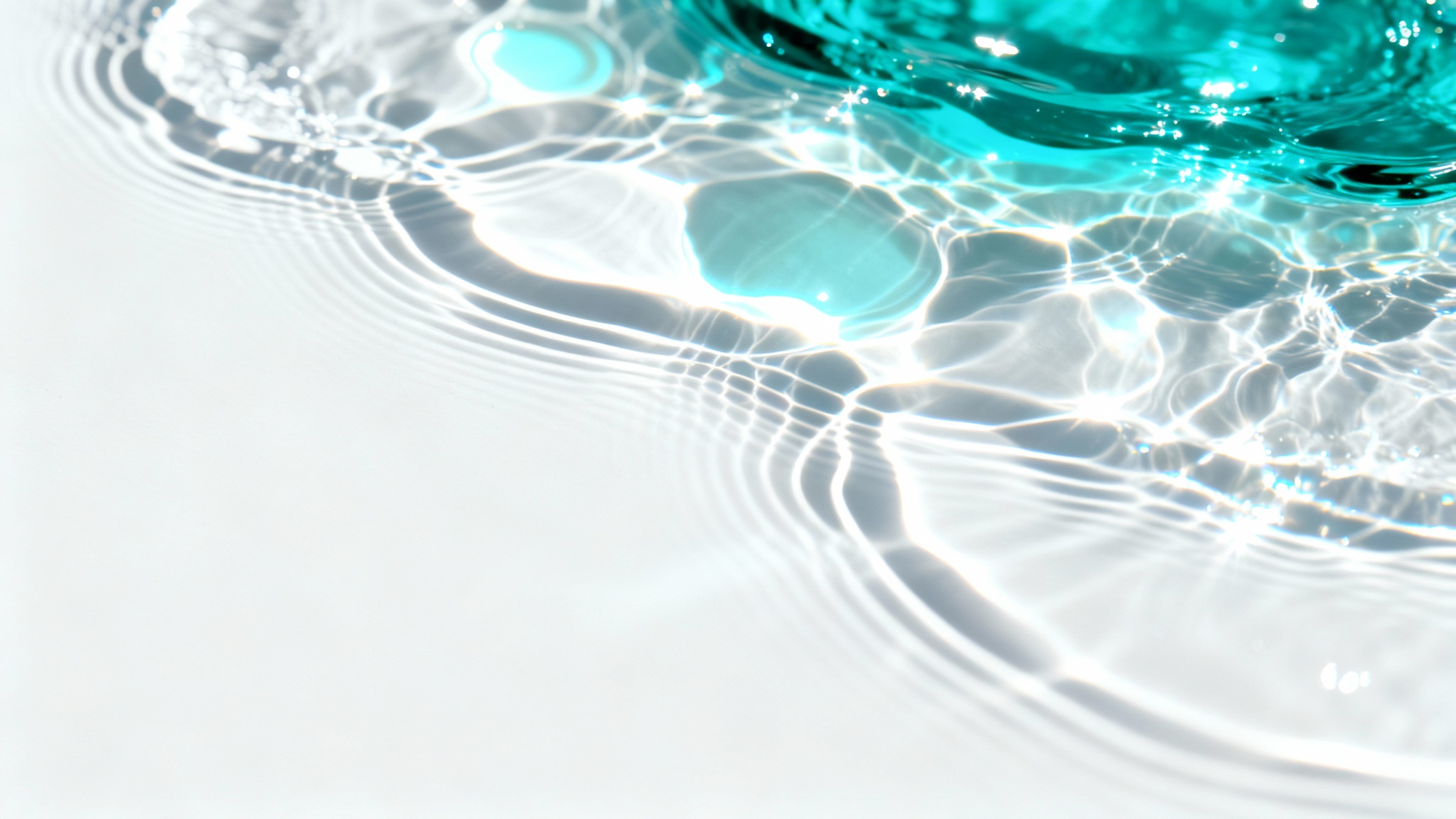 An abstract image of a caustics overlay, featuring shimmering patterns of cyan and white light on a clean white background, mimicking the effect of sunlight refracting through water.