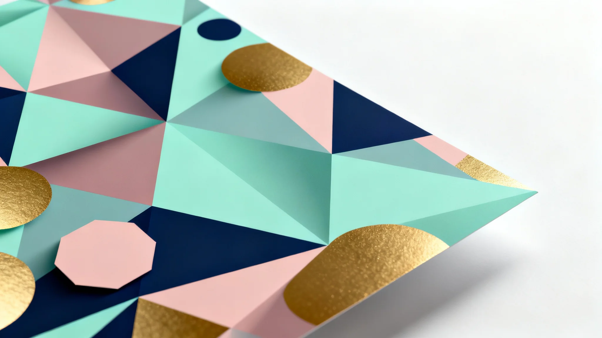 A modern geometric background featuring an abstract pattern of overlapping triangles and hexagons in mint green, dusty rose, and navy blue, with gold accents, displayed against a clean white background.