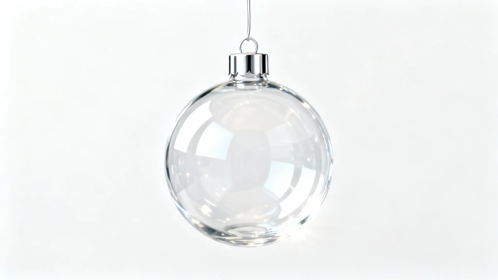 A photorealistic mockup of a single, clear glass Christmas ball ornament with a silver cap, hanging against a stark white background, showcasing its transparency and elegant design.