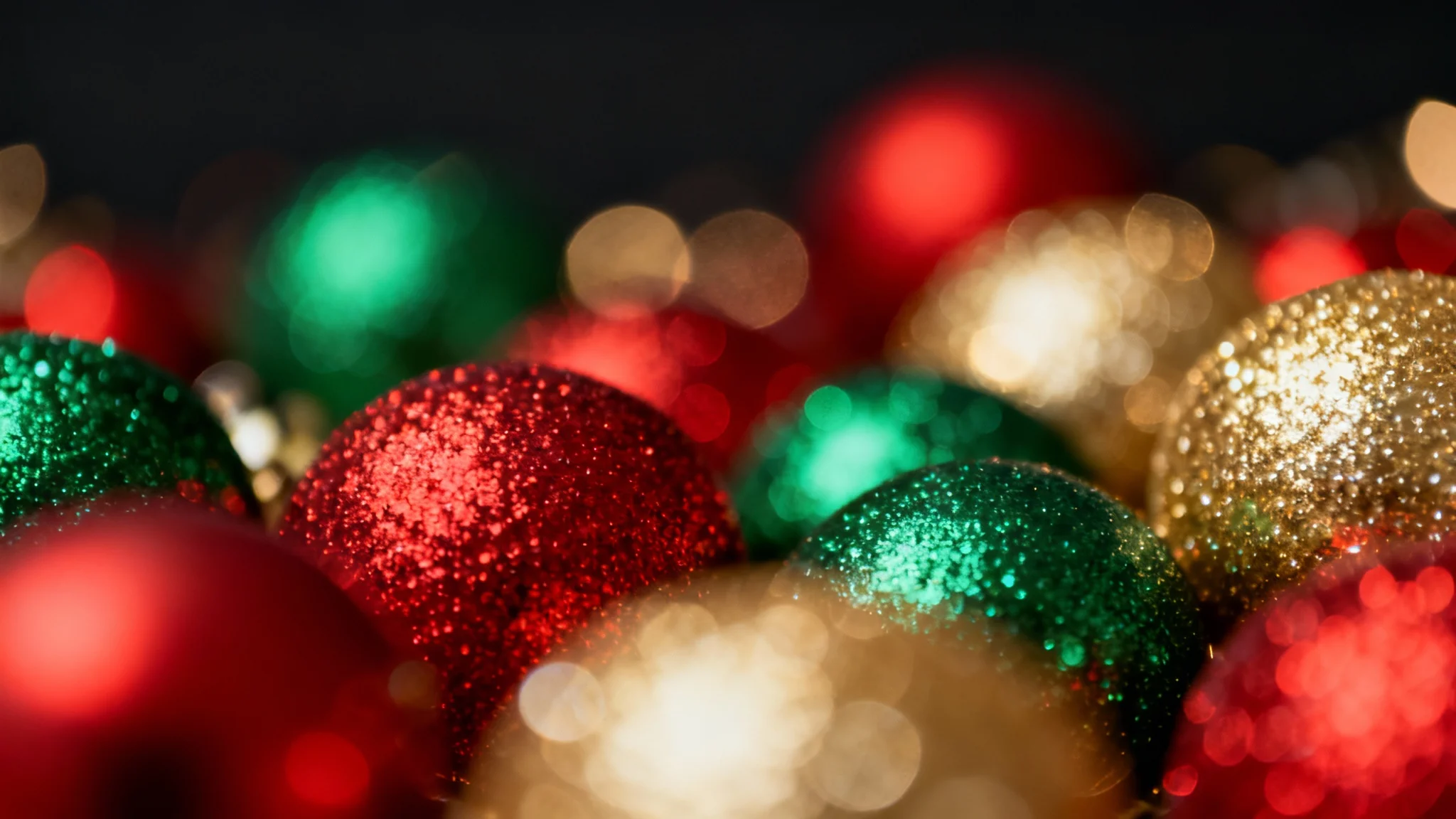 A vibrant and festive Christmas bokeh background with out-of-focus red, green, and gold lights creating a warm, magical atmosphere.