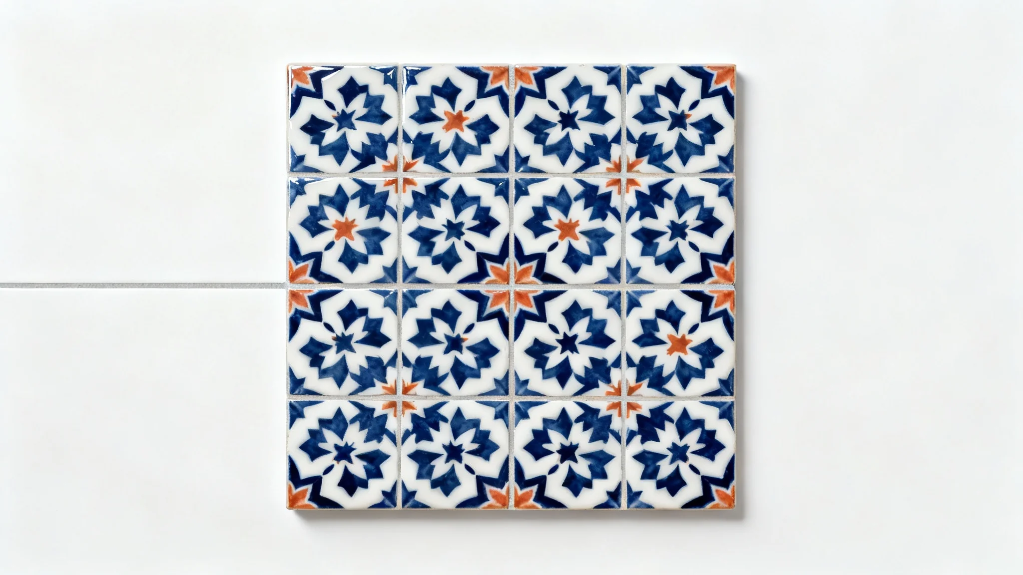 A top-down view of a sophisticated tile pattern with interlocking navy blue, white, and terracotta geometric shapes, presented as a mockup on a white background.