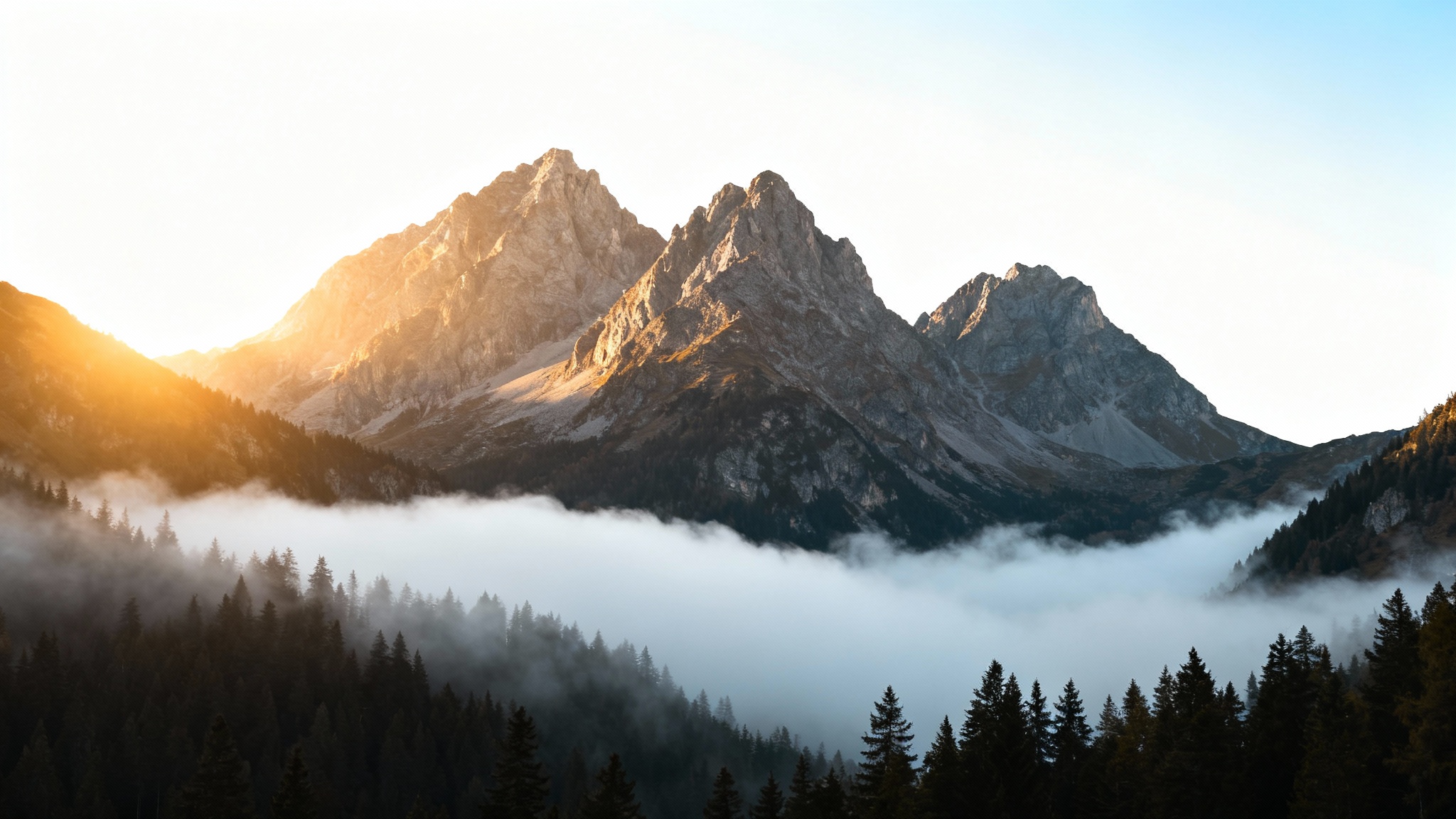 A photorealistic image of a mountain range with a thick layer of mist filling the valley below, illustrating the 'add mist' effect.