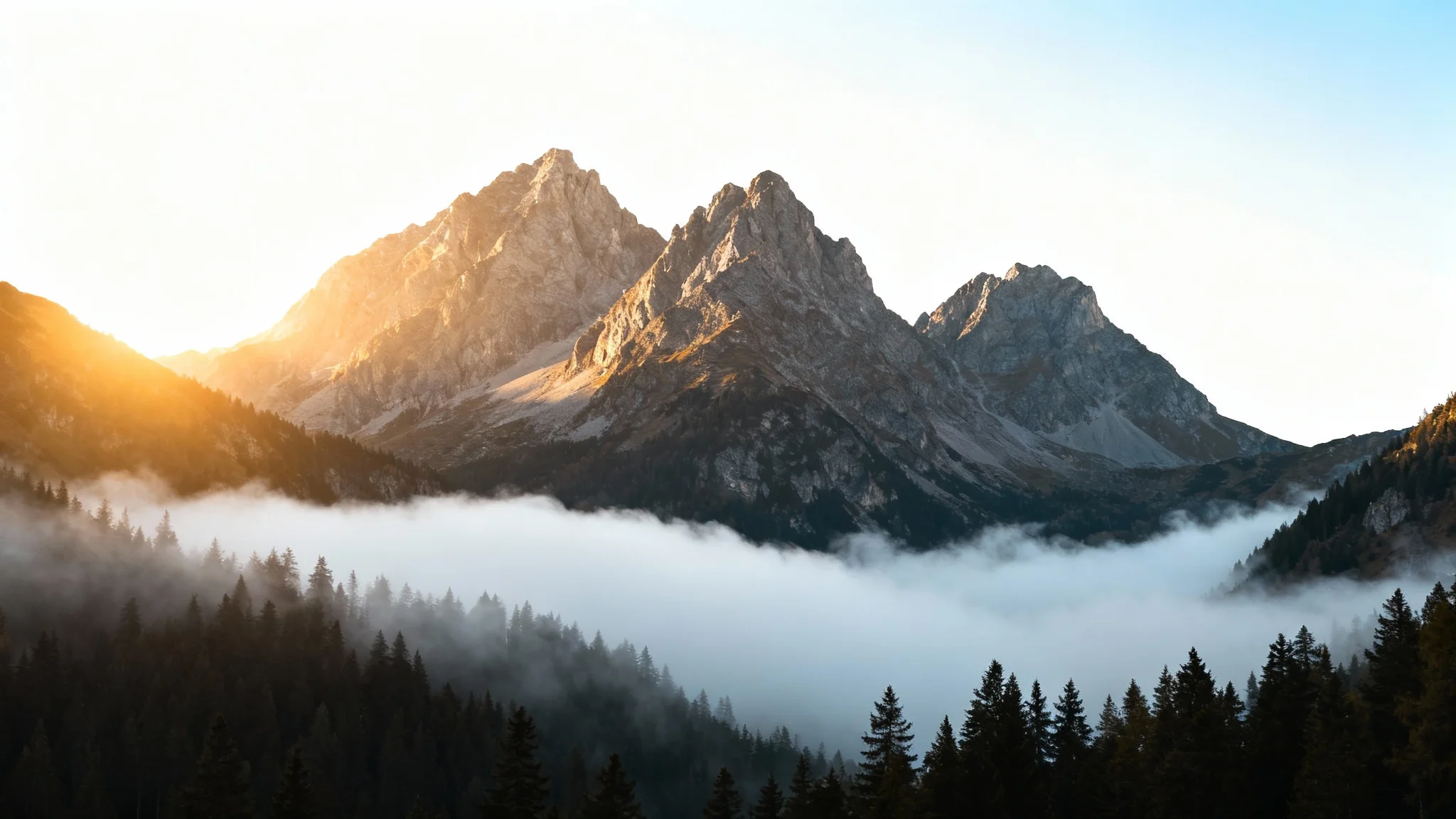 A photorealistic image of a mountain range with a thick layer of mist filling the valley below, illustrating the 'add mist' effect.