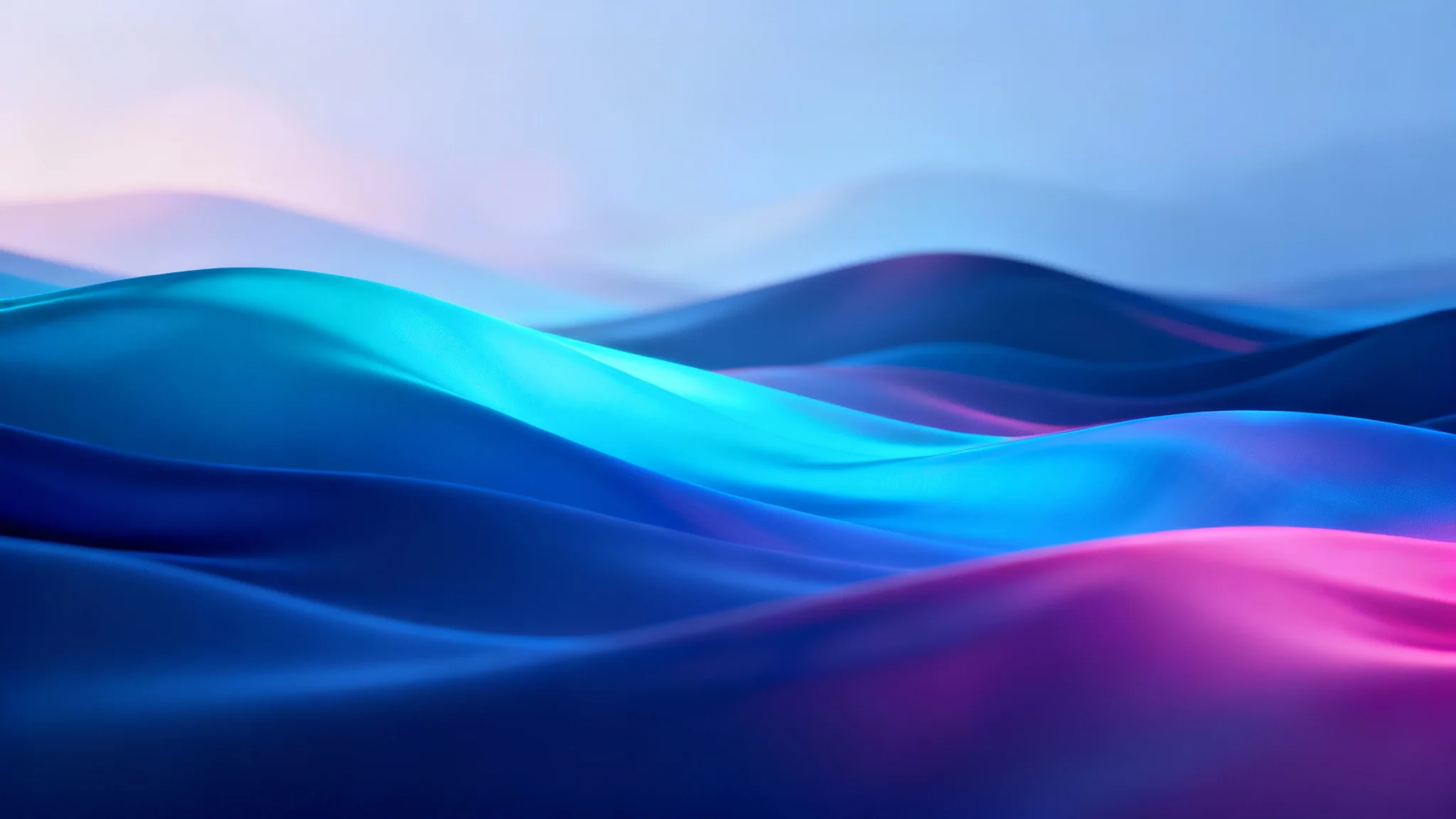 A high-resolution landscape wallpaper designed in the style of Windows 11, showing abstract, flowing shapes in blue and magenta that resemble serene, glowing hills.