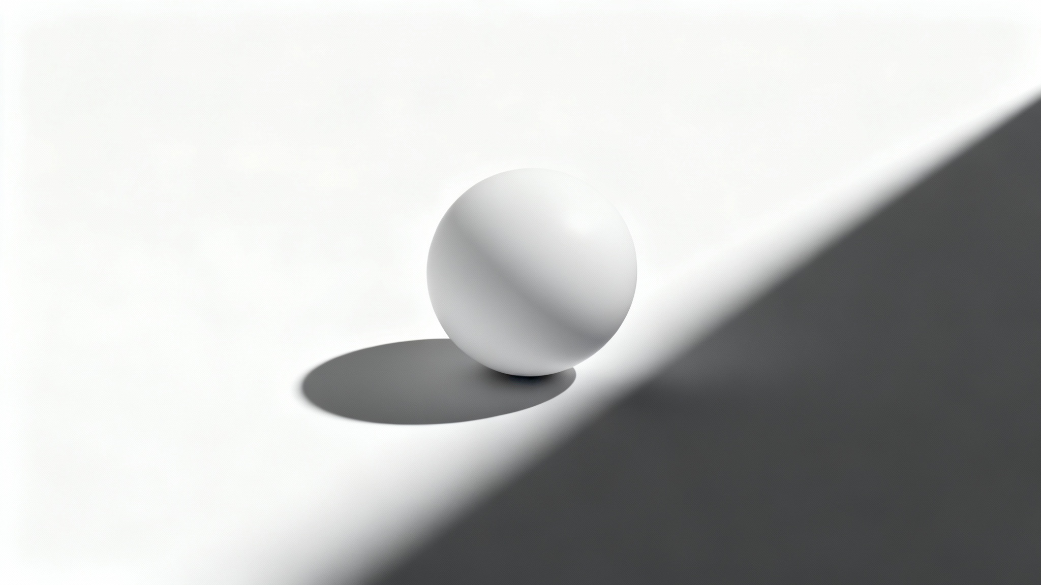 A modern white sphere on a white surface, casting a long, sharp, and dramatic shadow, illustrating the effect of adding a shadow to an object.